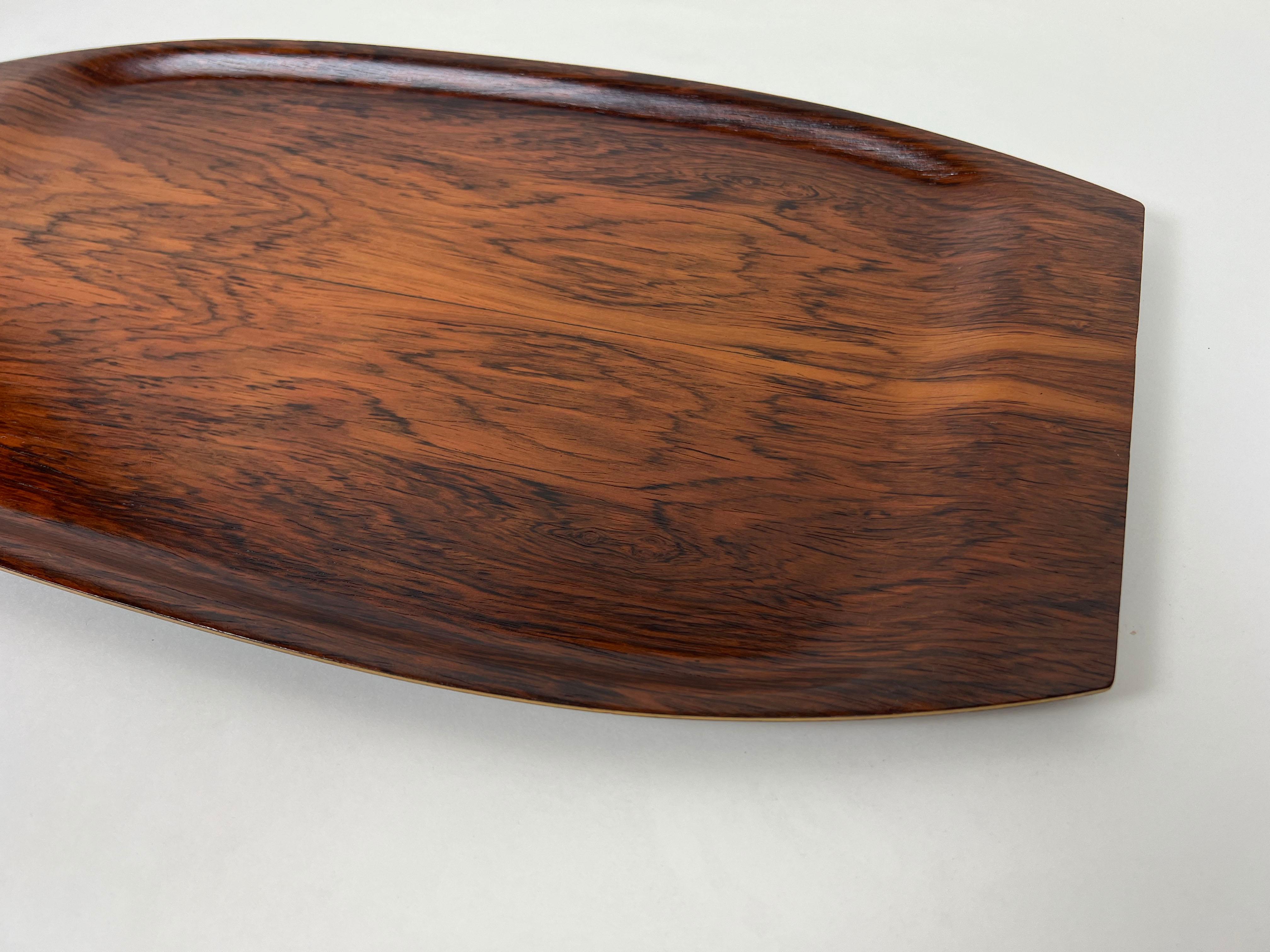 Vintage Scandinavian bentwood tray by Åry Fanérprodukter Nybro in beautifully figured Brazilian Rosewood.

Designer: Nils Trautner

Manufacturer: Åry Fanérprodukter Nybro

Origin: Sweden

Year: 1960s

Style: Mid-Century Modern /