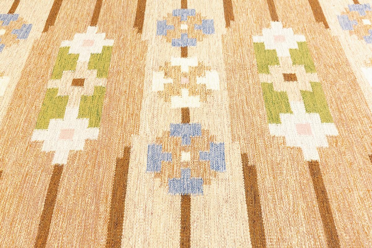 This exquisite Scandinavian rug, measuring 223 × 170 cm (7' 3