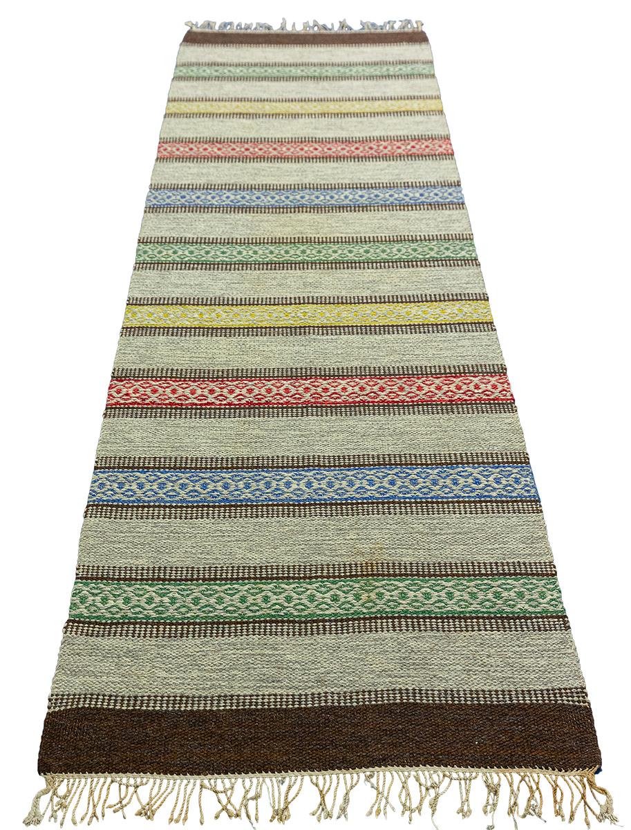 The Swedish Rollakan rug is a timeless masterpiece of woven textiles. With its simplistic stripe pattern design, flat weaving technique and interesting design, this rug can easily become the highlight of any room in your home. It offers a