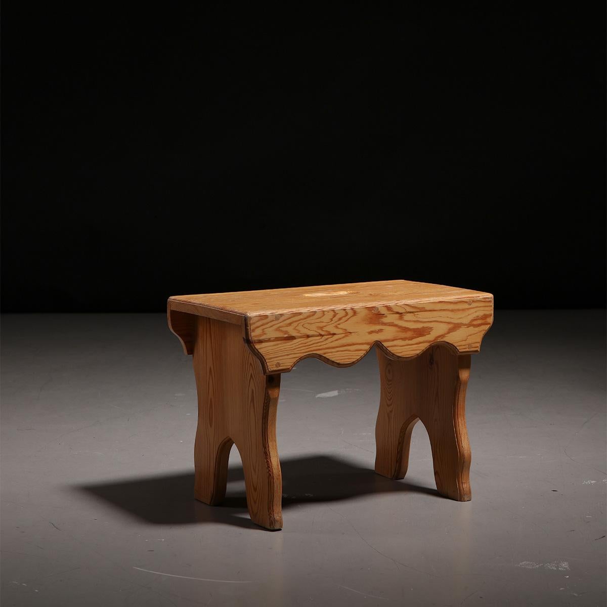 Scandinavian sculptural pine stool or small side table, made in Sweden, 1940s.

This wooden stool or small side table is unique and sculptural in its design due to the form of the legs and seat, all made out of pine wood featuring beautiful signs of