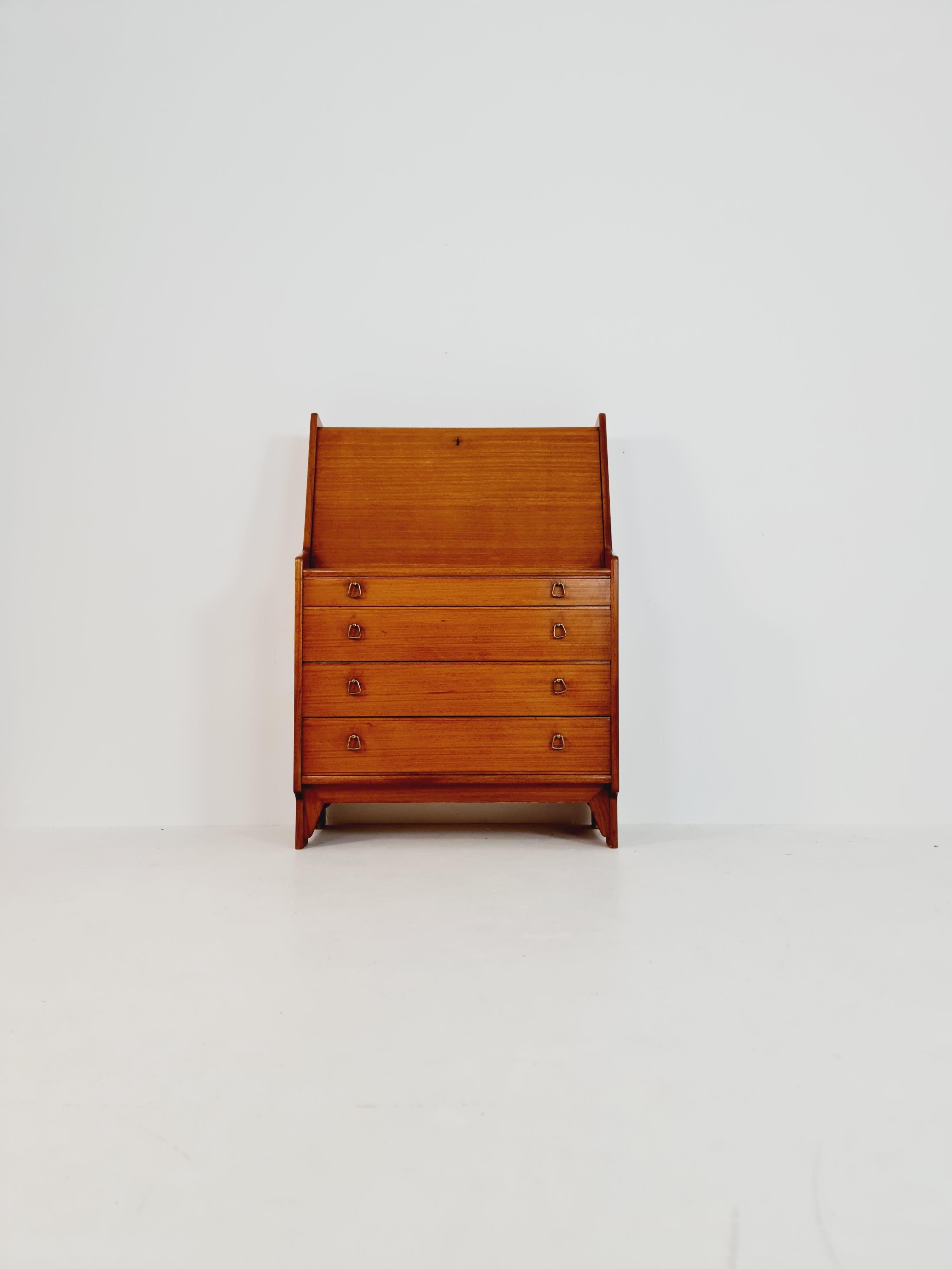 Mid century Scandinavian Secretary with drawers mahagony by Gjövik Möbler, Norway, 1960s

Design year: 1960s

Dimensions: : 44 D x 86 W x 133 H cm
Writing area extends: 45  x 82  cm

It is in good vintage condition, however, as with all vintage