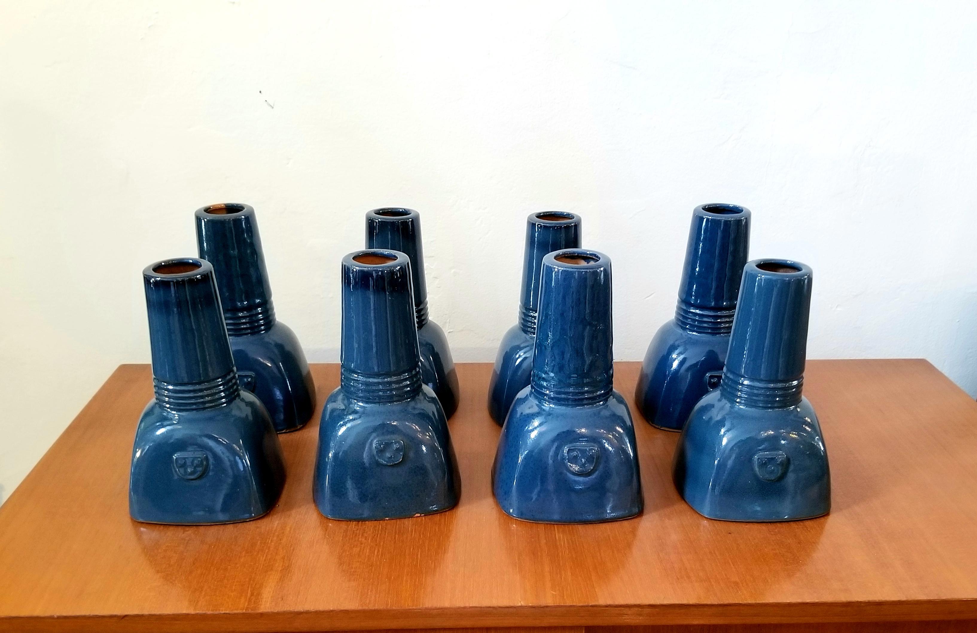 Set of eight sculpture vases. Each vase is hand colored shaped and sized. Vases can use for the flowers. We have 4 more vases like this.
