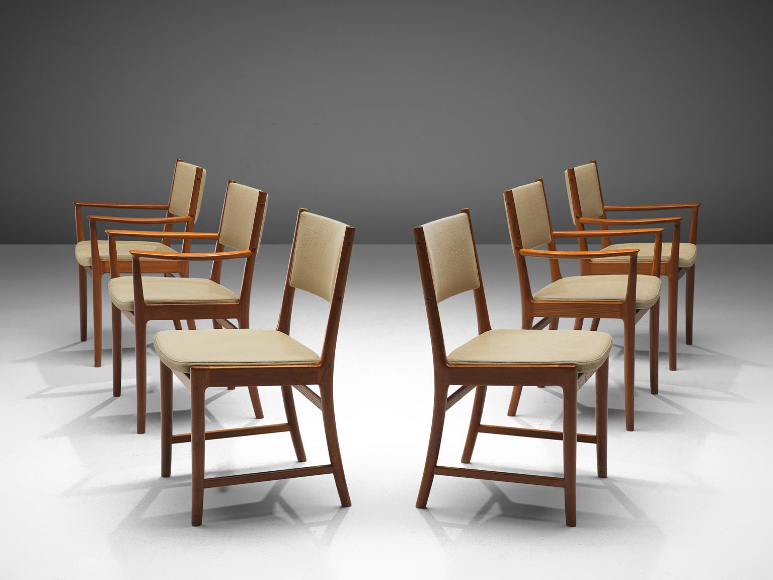 Kai Lingfeld Larsen, set of six dining chairs, teak and beige fabric, Scandinavia, 1950s. 

These elegant teak dining chairs are both stately and modest. Four of these chairs contain armrests. These Scandinavian chairs have a teak frame with a
