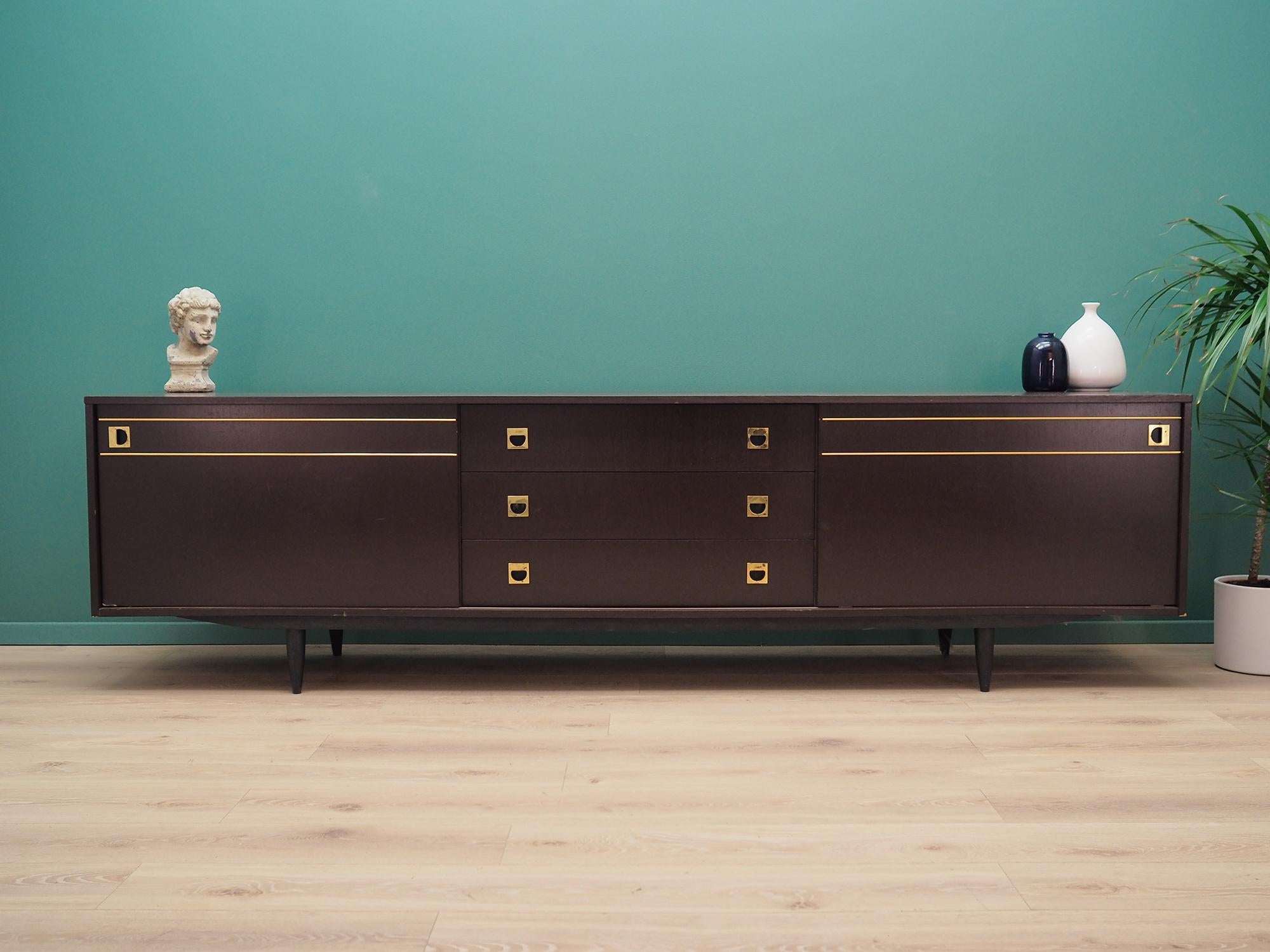 An extraordinary 1970s-1980s sideboard, a brilliant form. Furniture made in Sweden. Preserved in good condition, directly for use (several scratches, abrasions visible).

Dimensions: height 69 cm, length 248.5 cm, depth 48.5 cm.