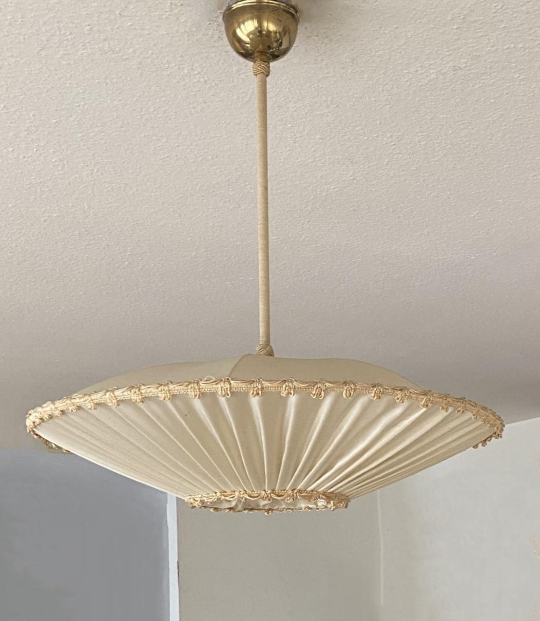 Rare beautiful Scandinavian design ceiling light manufactured in Sweden, 1930-1840s. Large hand-made silk shade with brass details. In good vintage condition, minor patina consistent with age and use, rewired. This pendant takes one E27 screw base