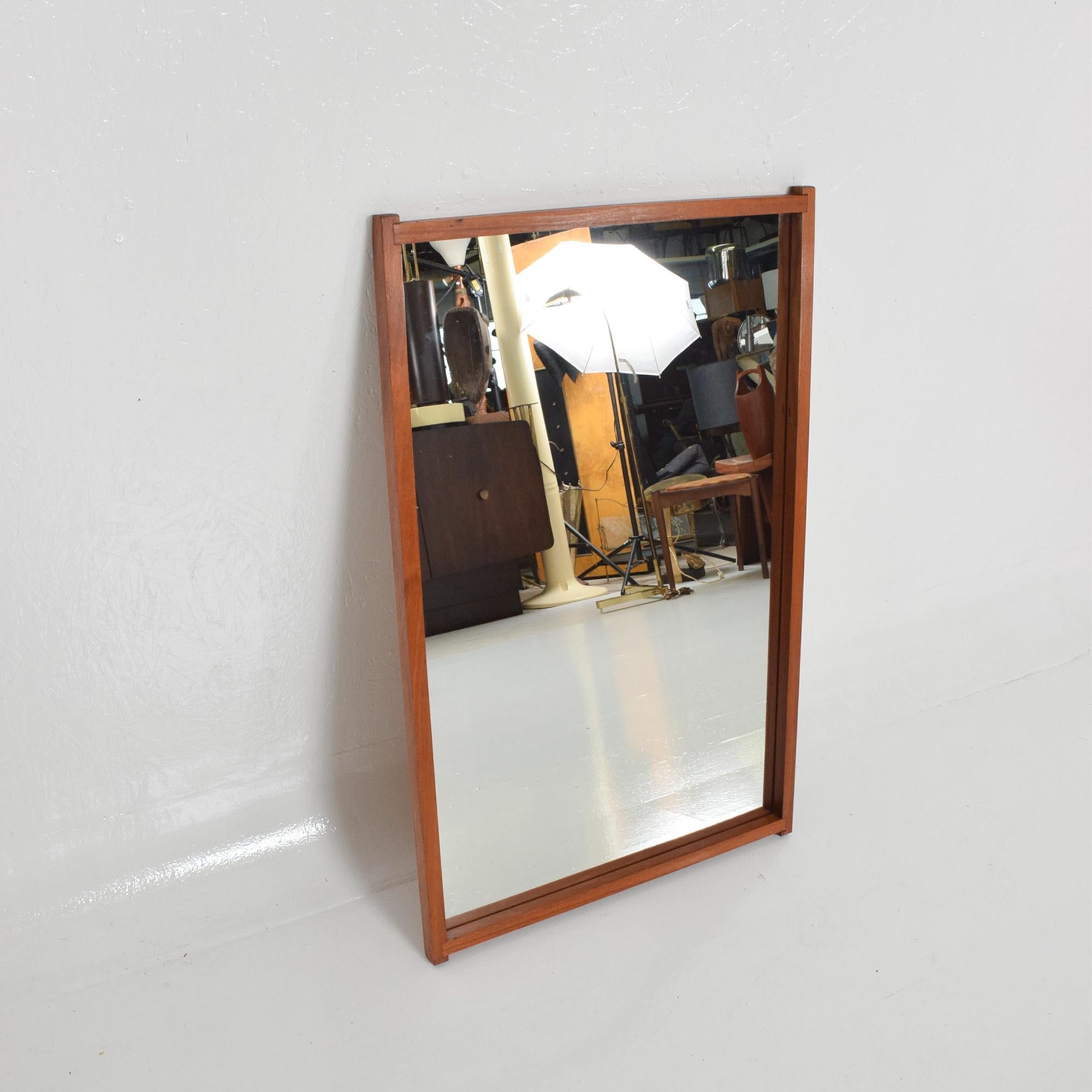 Vintage Scandinavian modern teak wall mirror, circa late 1970s
Solid teak wood frame with glass mirror.
In the style of Midcentury Danish modern designers Pedersen and Hansen and Aksel Kjersgaard.
No label present from the maker.
Dimensions: 38