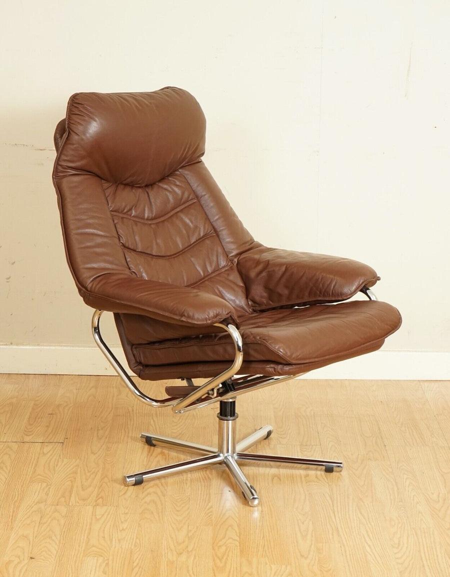 Very comfortable Skoghaus Industry brown leather recliner lounge chair and footstool

We have lightly restored this by giving it a hand clean, hand waxed, and hand polished it.

Dimensions: 
Chair: 78 W x 88 D x 103 H cm
Seat: 43 W x 50 D x 49