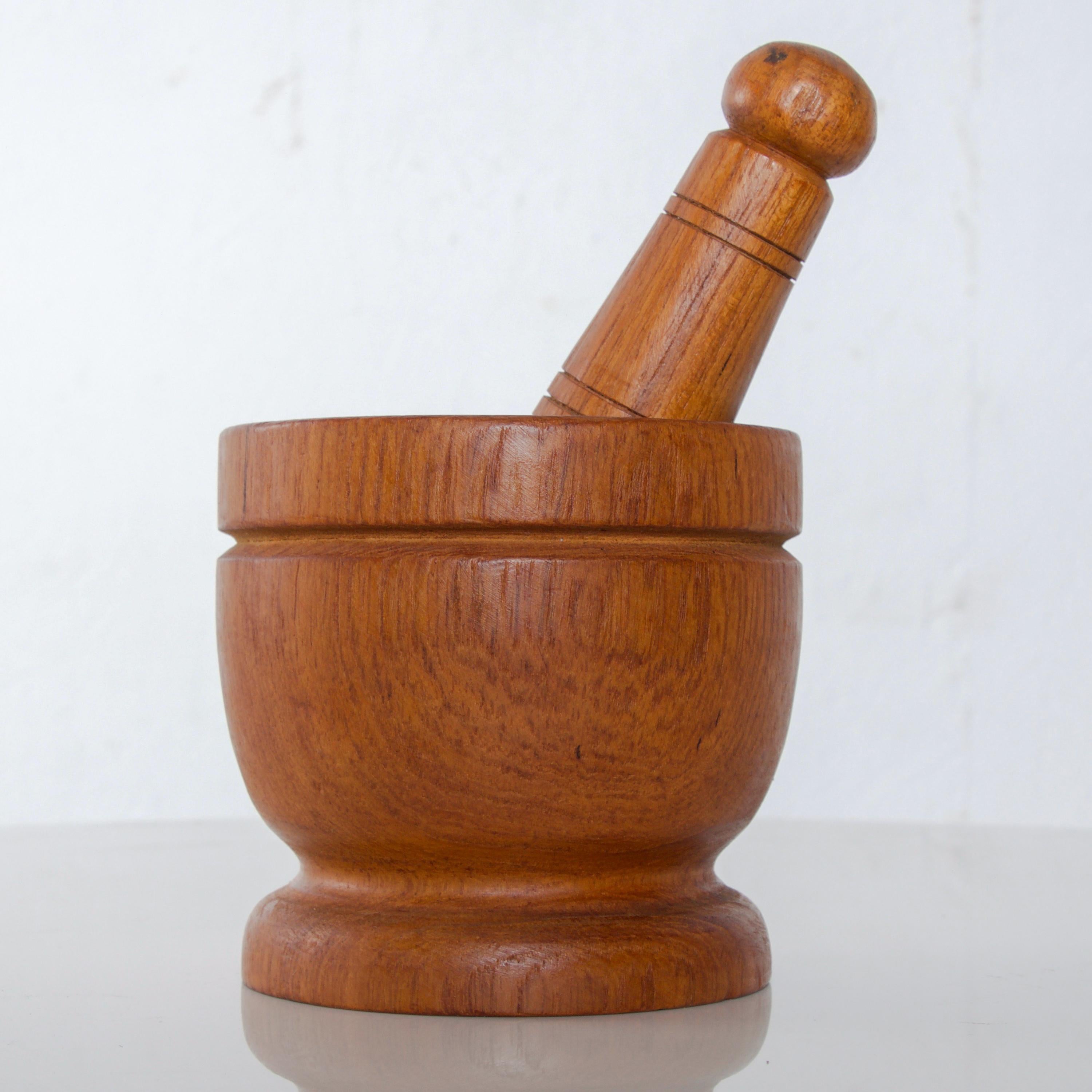 Vintage Mid-Century Modern Scandinavian solid teak wood mortar and pestle, circa 1960s, Sweden
Attributed to Karl Holmberg Akta Teak Gotene, Sweden
Measures: Mortar 3.5 height x 3.5 inches diameter, pestle 5.25 length x 1.25 inches diameter
No label
