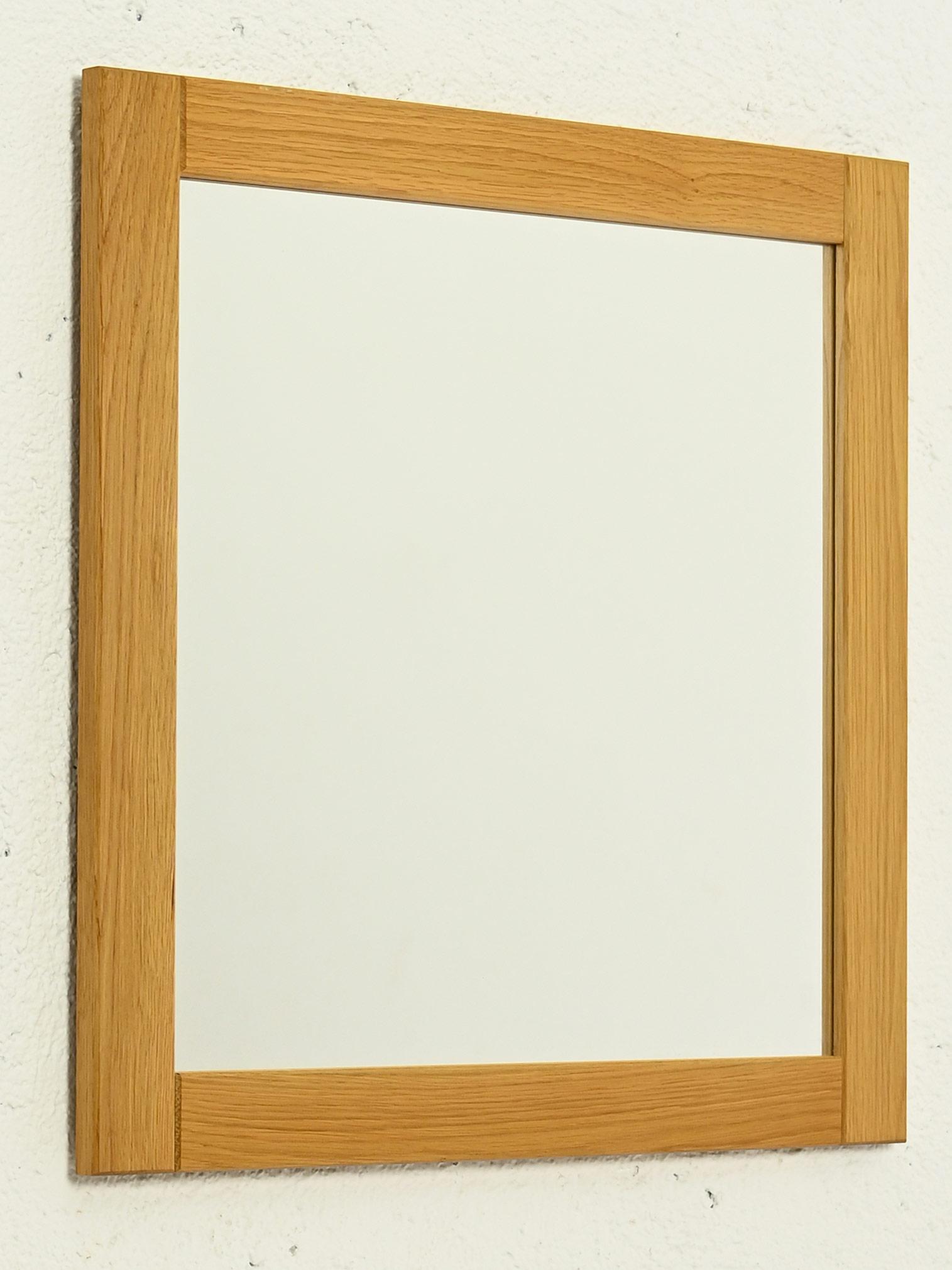 Nordic 1960s oak mirror.

A moderately sized mirror with a thick, square edge, made with clean, classic lines that reflect the elegance of Scandinavian craftsmanship.
This oak mirror gives a warm and welcoming touch for those who appreciate