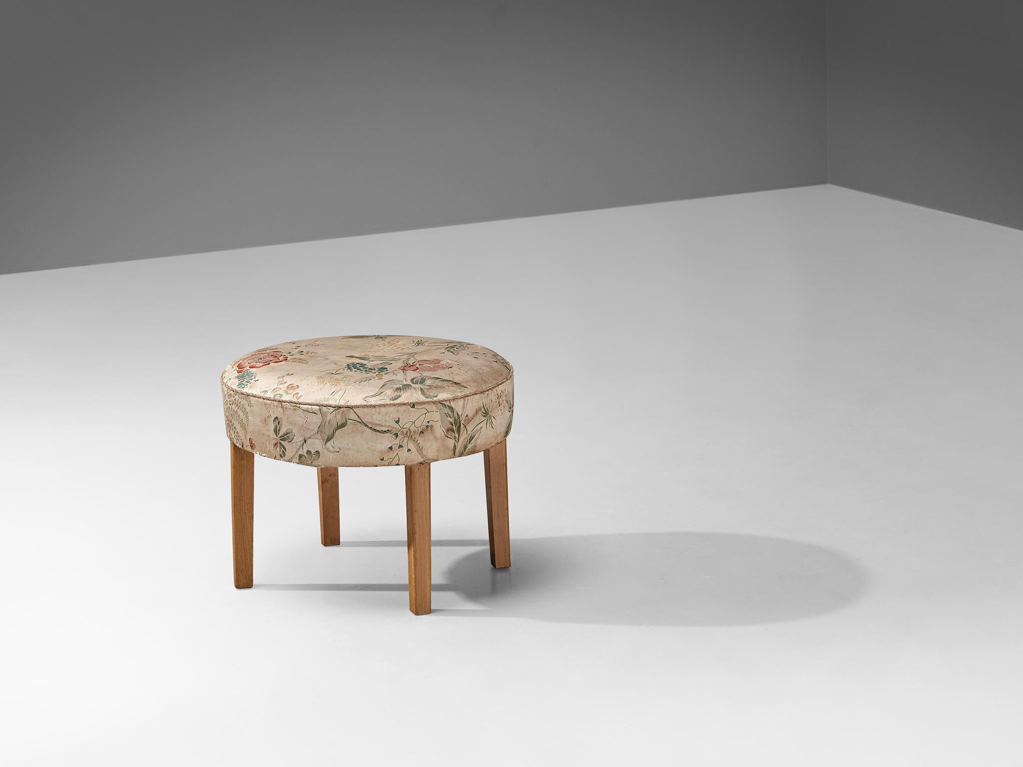 Stool, tabouret, ottoman, fabric, stained wood, Scandinavia, 1940s.

This poetic pouf is designed in the 1940s and is a charming emergence in an interior or space. In this design a harmonious appearance is displayed, a sturdy base in combination