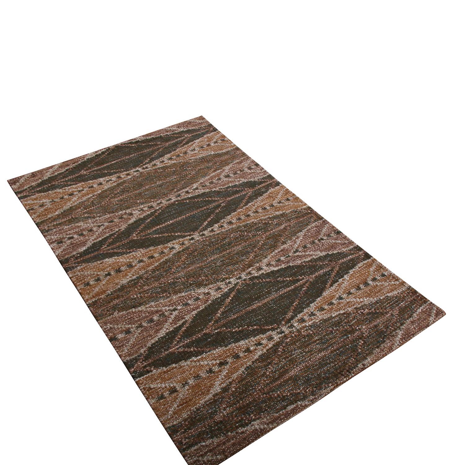 Rug & Kilim presents a custom piece from its Kilim & Flatweave selections. Handwoven in wool, this piece enjoys a defined geometric pattern in chocolate brown, green, gold, and beige-gray tones with tasteful abrash variations in beige for an