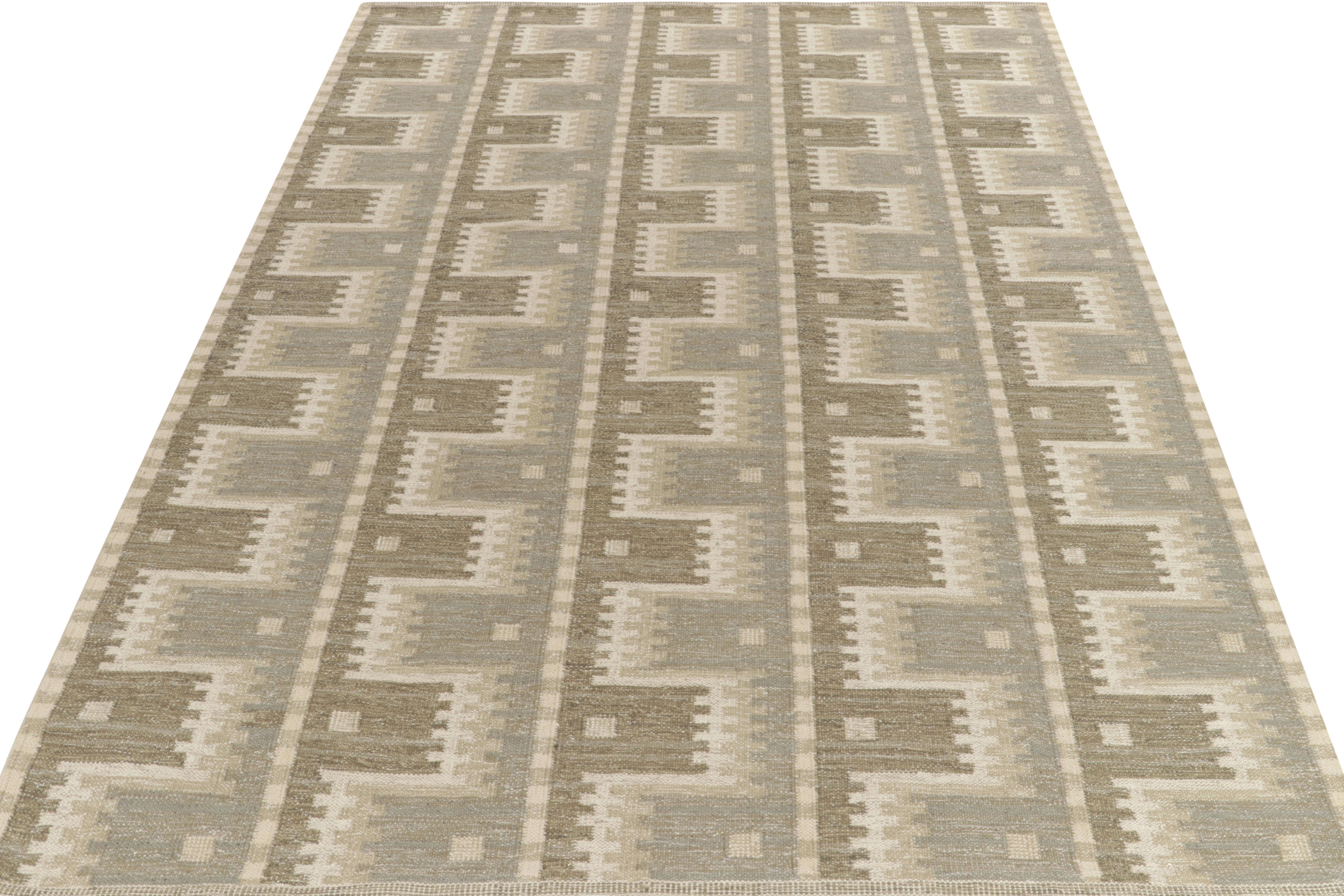 Handwoven in fine quality wool, a custom design from our award-winning Scandinavian flat weave texture. Exemplified in this 9x12 scale, this kilim rug features a sharp geometric pattern in gray, beige-brown, white & a hint of stone blue for an