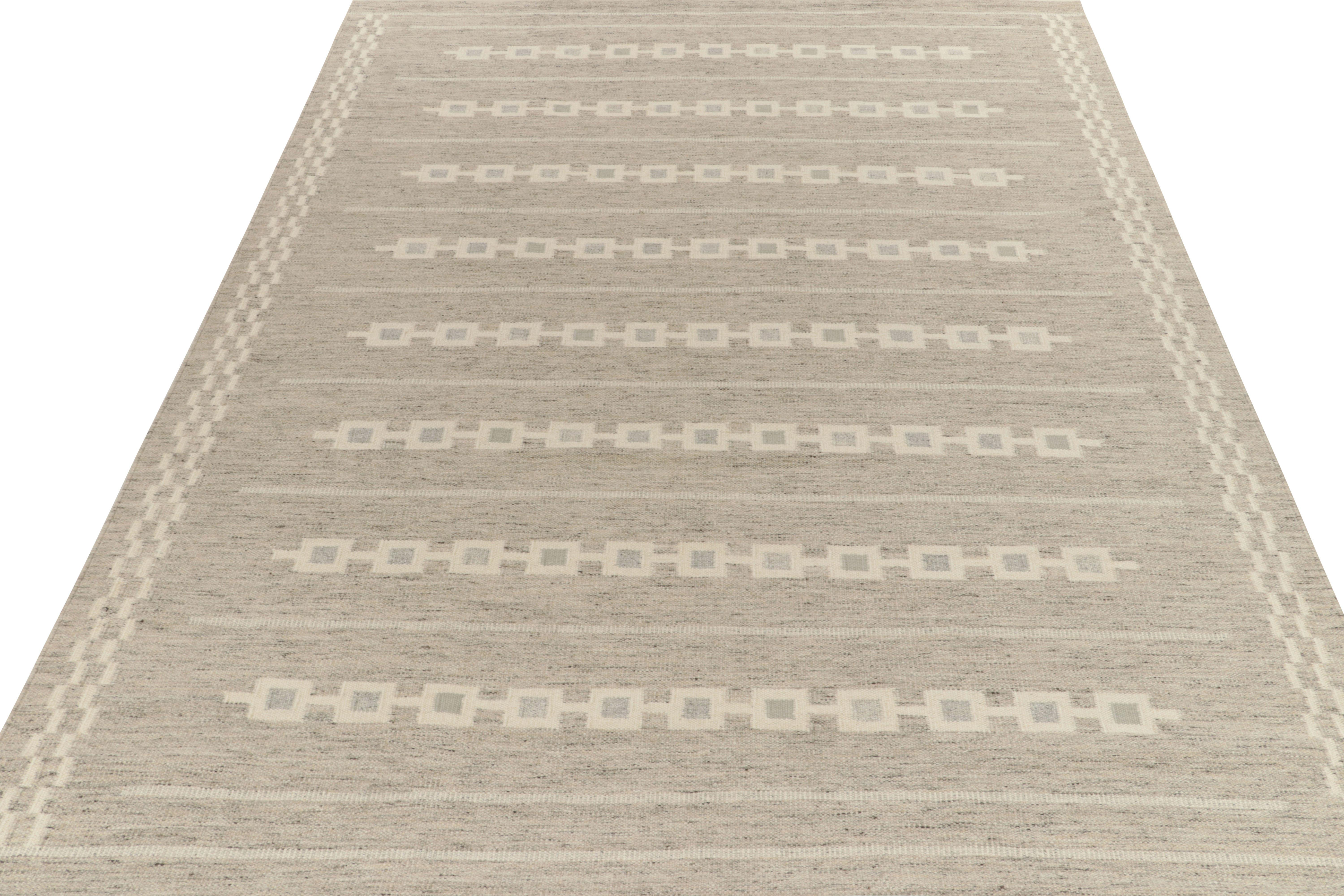 Handwoven in fine quality wool, a custom design from Rug & Kilim’s celebrated Scandinavian flat weave collection. Exemplified in this former 10x14 scale, the vision relishes a clean, forgiving look with horizontal stripes and chain series in gray &