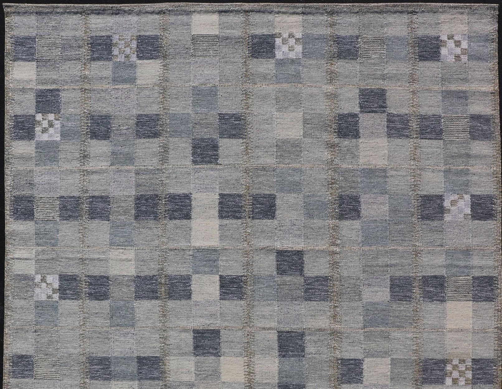 Gray and blue Scandinavian flat-weave design rug with geometric design, Keivan Woven Arts, rug RJK-44522-SHB-137-01, country of origin / type: India / Scandinavian flat-weave.

This Scandinavian flat-weave is inspired by the work of Swedish