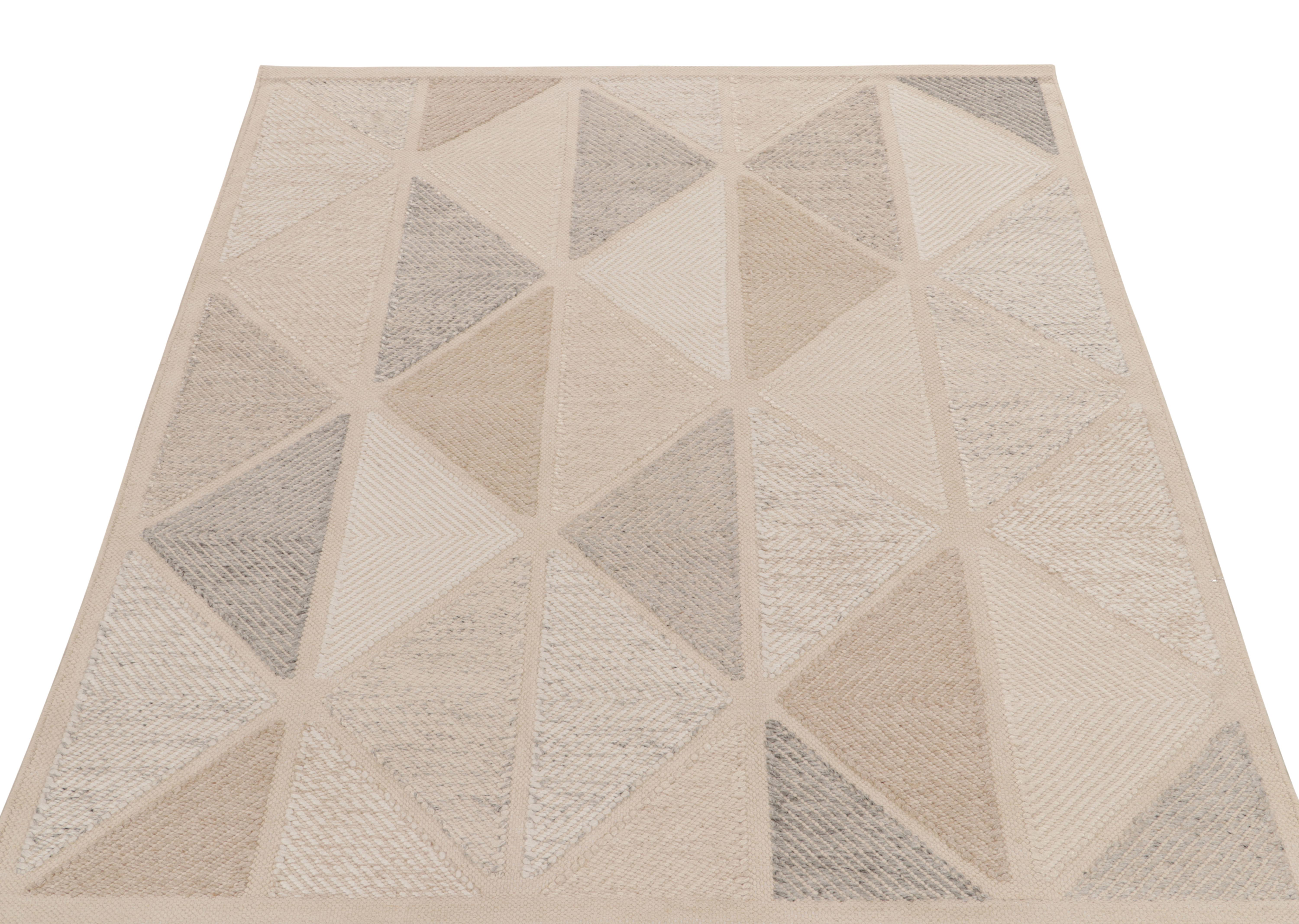 Rug & Kilim presents this exquisite 6x7 Scandinavian kilim from the Morocco line of the award-winning flat weave texture. The handwoven piece flows in an all over half diamond pattern in a delightful blend of beige, stone blue, gray & white. The