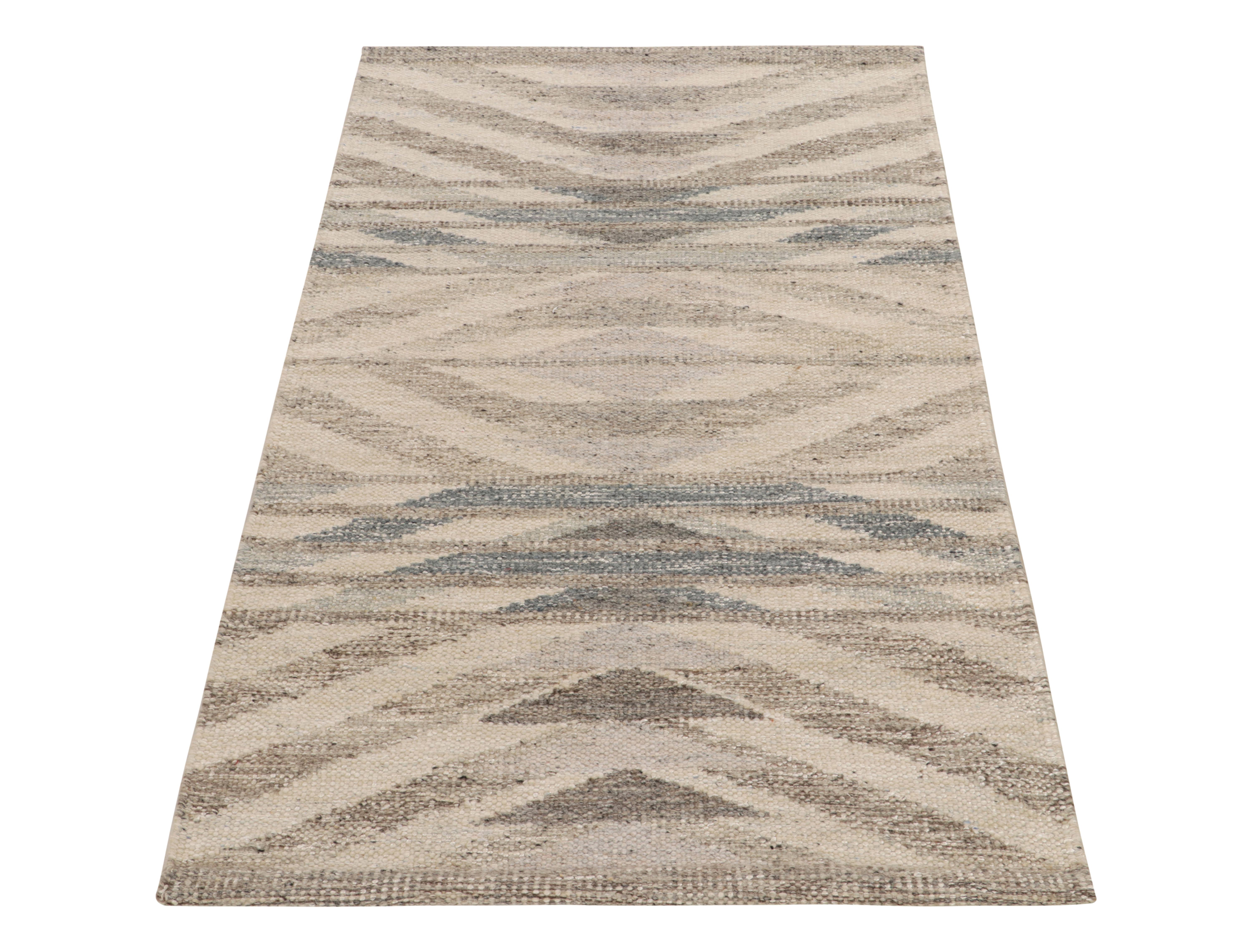 Handwoven in wool, a contemporary take on mid-century Swedish flatweaves from Rug & Kilim’s acclaimed Scandinavian collection. The 3x5 kilim enjoys a repetitive geometric pattern in beige, gray & blue, complemented by a blend of undyed natural yarns