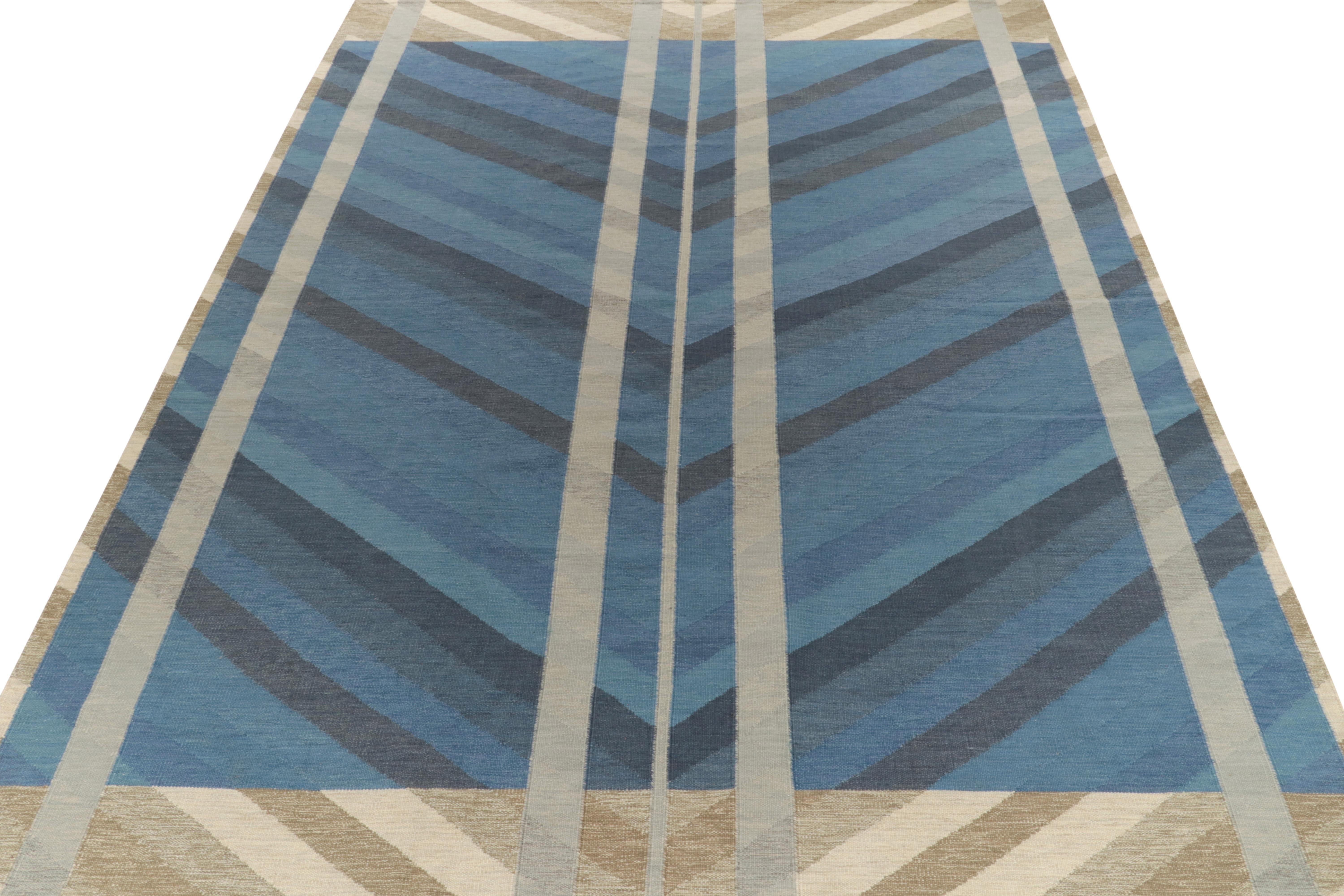 From our celebrated flat weave texture of the acclaimed collection, a 13x17 Scandinavian style kilim rug showcasing movement & symmetry. Handwoven in wool, the crisp striations embody the smartness lent by tones of blue, beige, brown & gray for a