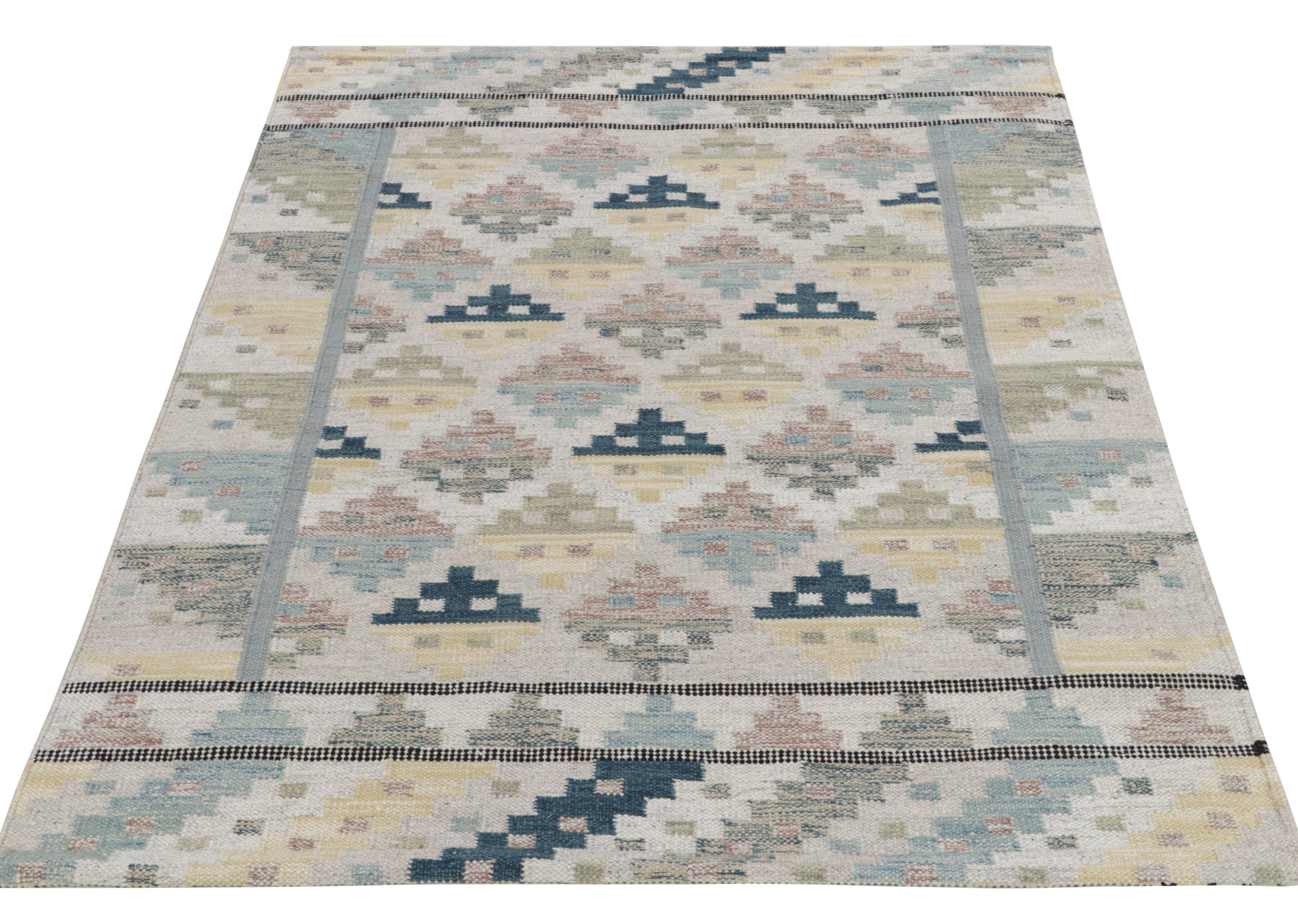 Among the smartest Swedish flatweaves from Rug & Kilim’s Scandinavian collection, this 6x8 handwoven kilim features a well defined geometric pattern in inviting tones of blue, beige, brown, gray and yellow for a calm approach in mid century