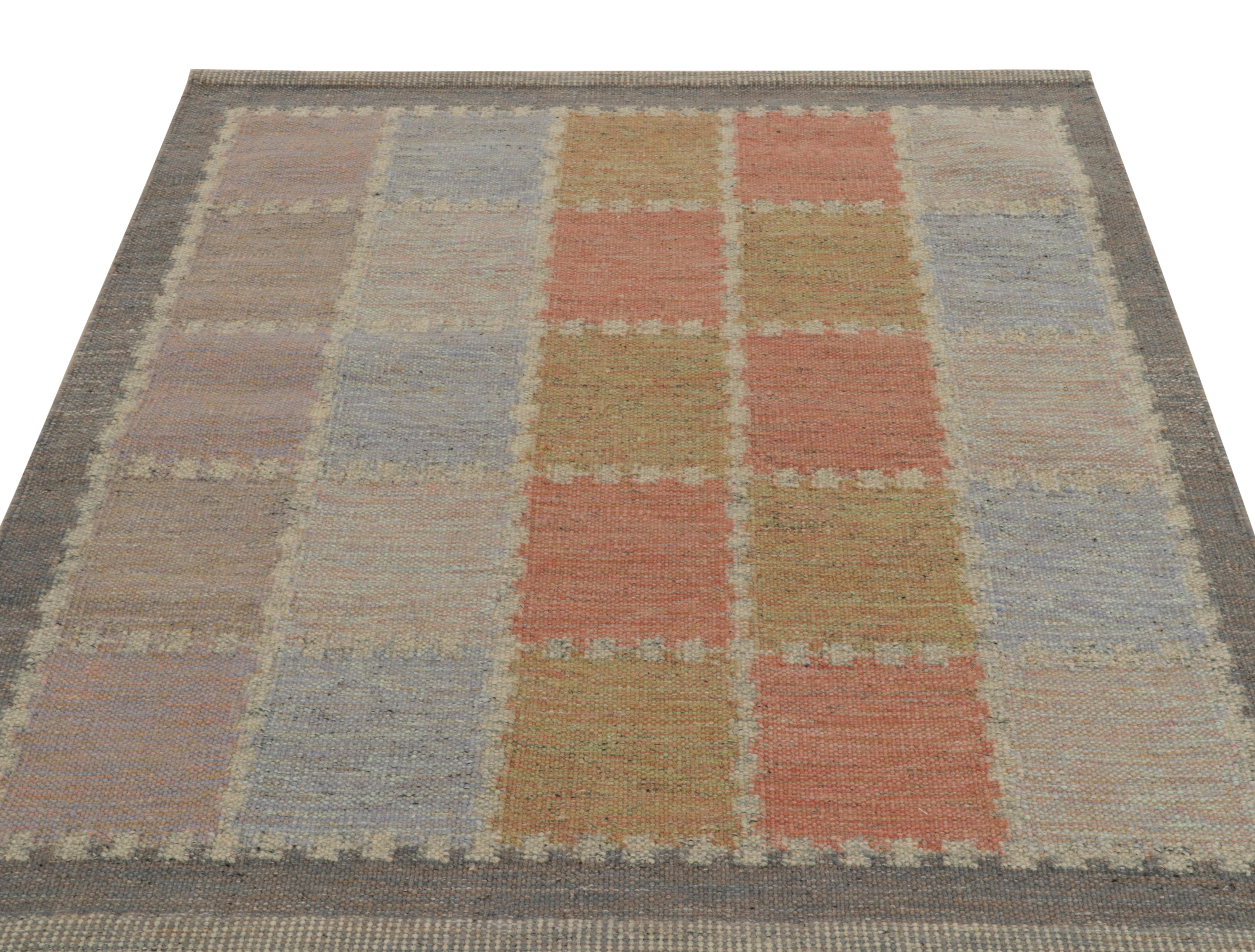 Handwoven in wool, a smart Scandinavian style kilim rug from our award-winning flatweave selections of the titular collection. The almost square size graph witnesses a symmetric geometric pattern in handsome gray, light blue, ochre and pink-red for