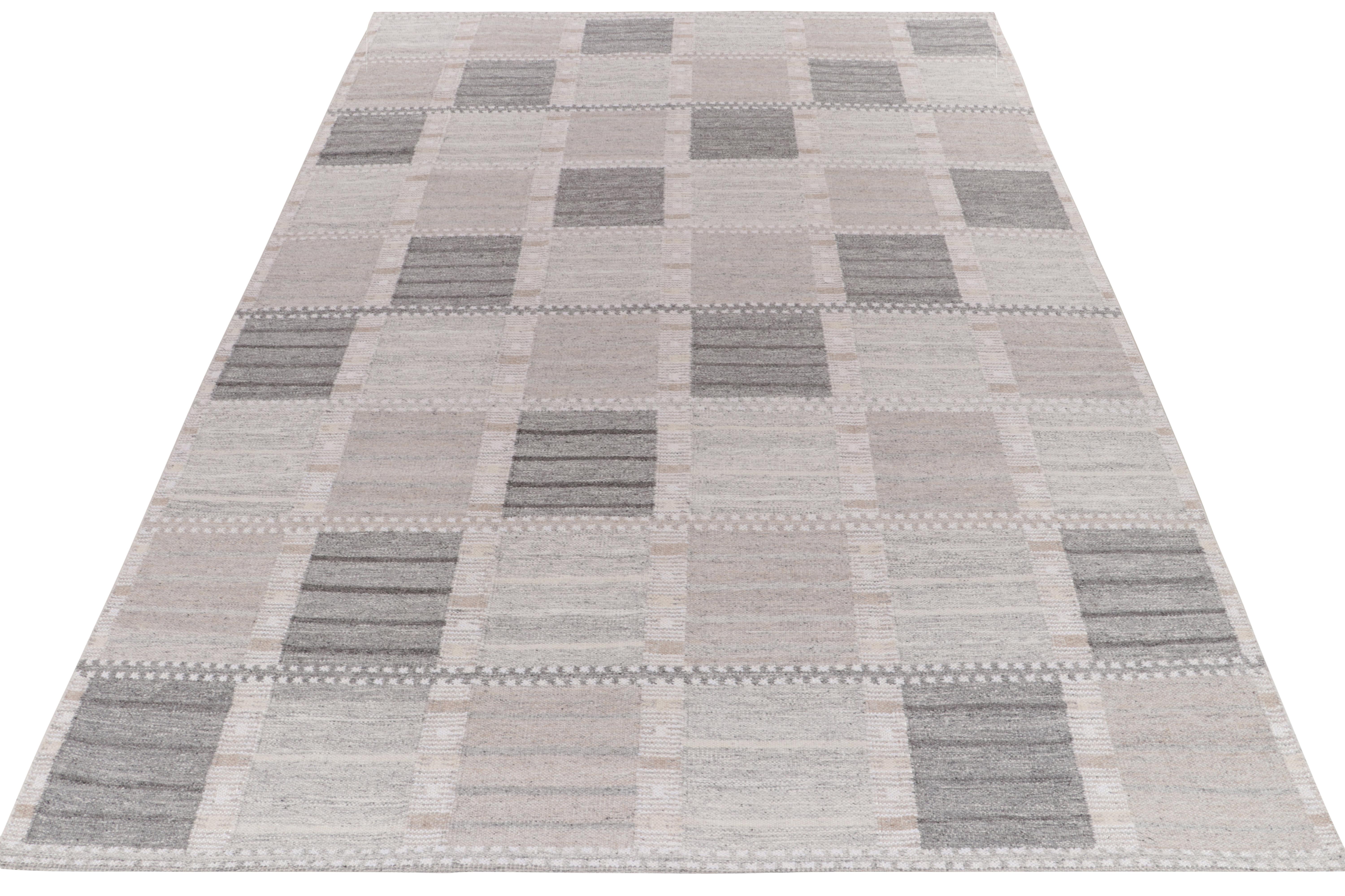 Exemplifying a contemporary take on Swedish Deco aesthetics, a 10x14 flat weave from Rug & Kilim’s award-winning Scandinavian collection. The handwoven rug enjoys a smart application of geometry with well-defined compartmentalisation in stone blue &