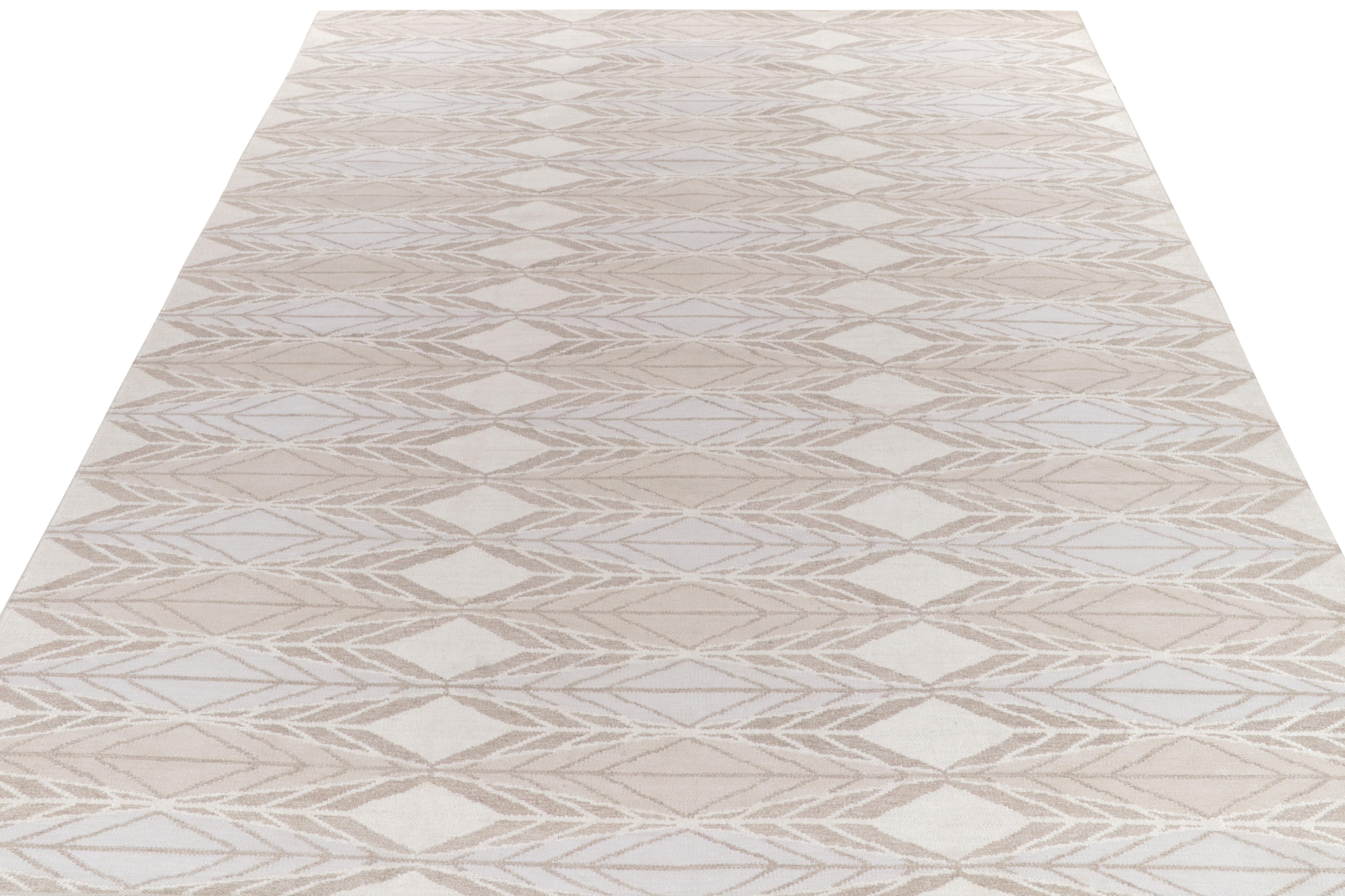 Handwoven in fine quality wool, a 11x15 kilim reflecting our passion for Scandinavian flatweaves, joining our titular award-winning collection. The rug features geometric repetition in sublime, chic blue & brown with off-white accents enjoying