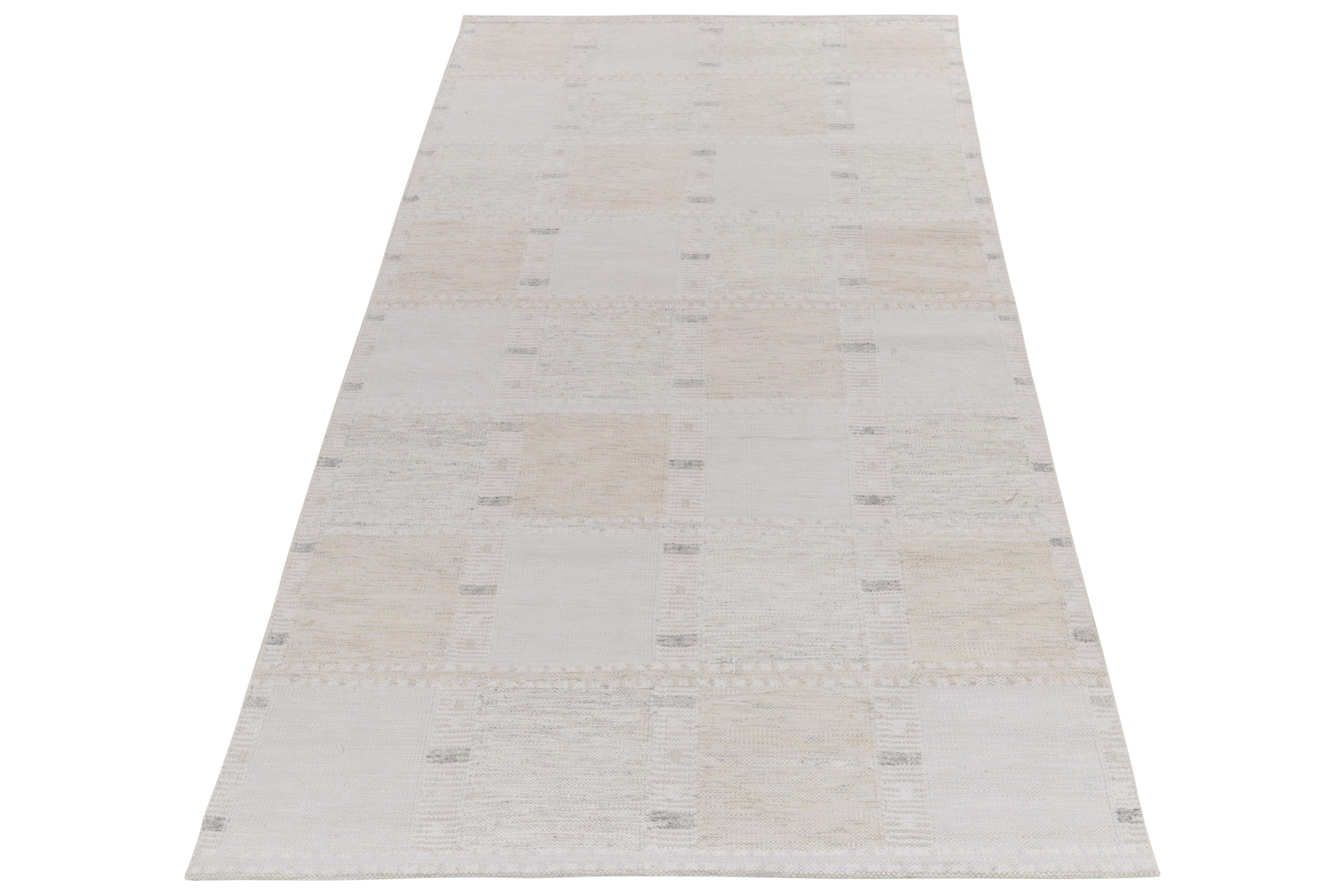 Handwoven in fine quality wool, a 6x10 Kilim from our award-winning repertoire of Scandinavian flatweaves. The kilim rug features a depthful geometric movement reveling in white, muted gray & beige tones with a quiet appeal in Swedish Modernist