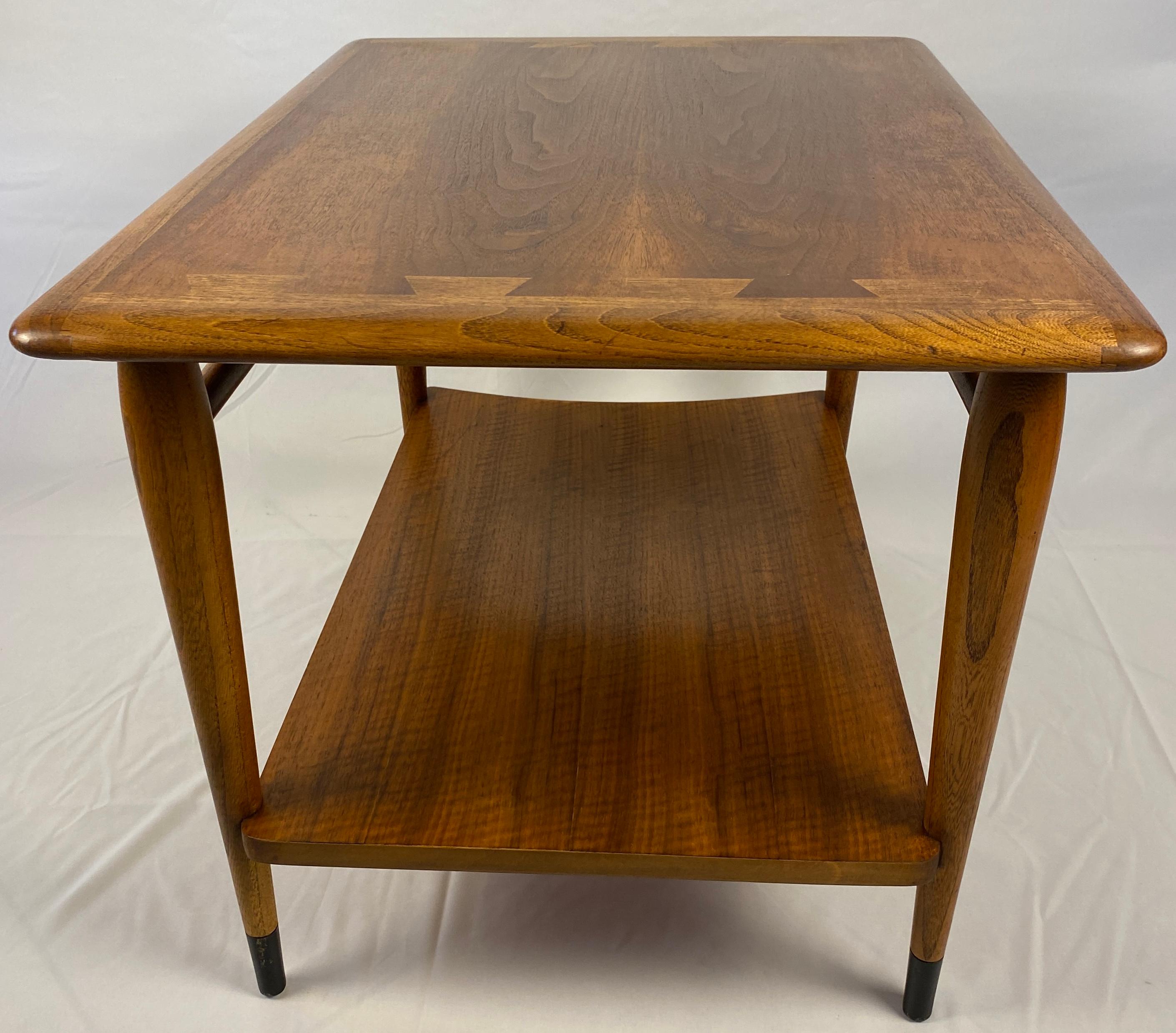 A very stylish Scandinavian style coffee table or end table made of solid walnut.  Clean lines and natural groves of the wood enhance the design of the gorgeous Scandinavian style wooden coffee table or end table. The bottom shelf is a helpful