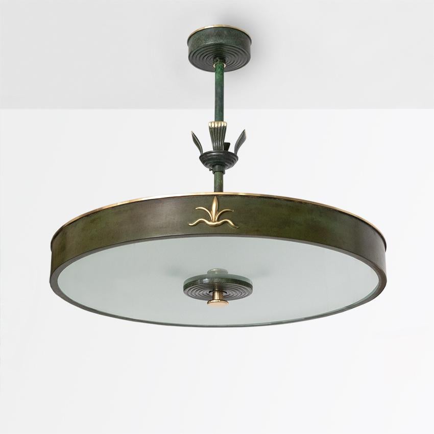 “Lilly” pendant made by Bohlmarks, Sweden circa 1930s. The fixture has been newly polished and rewired with 3 standard base sockets for use in the USA. The original glass shade is sandblasted. 

Measures: Diameter 21”, height 17.5”.
