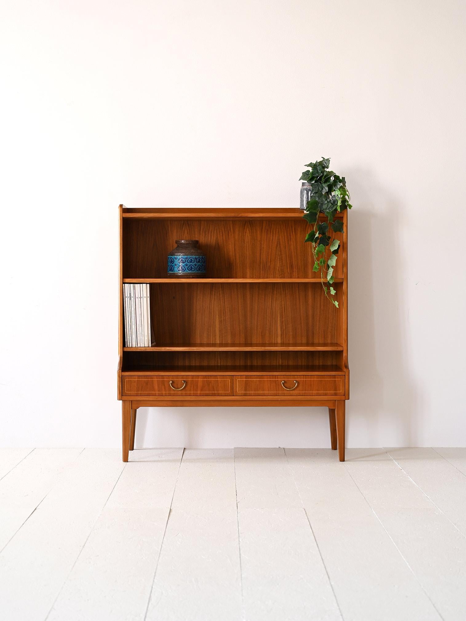 Vintage 1960s cabinet with shelving and drawers.

This particular piece of Nordic-made furniture is distinguished by its height of 112 cm, which also makes it ideal for use in the entryway, hallway or bedroom.
It consists of three shelves and two