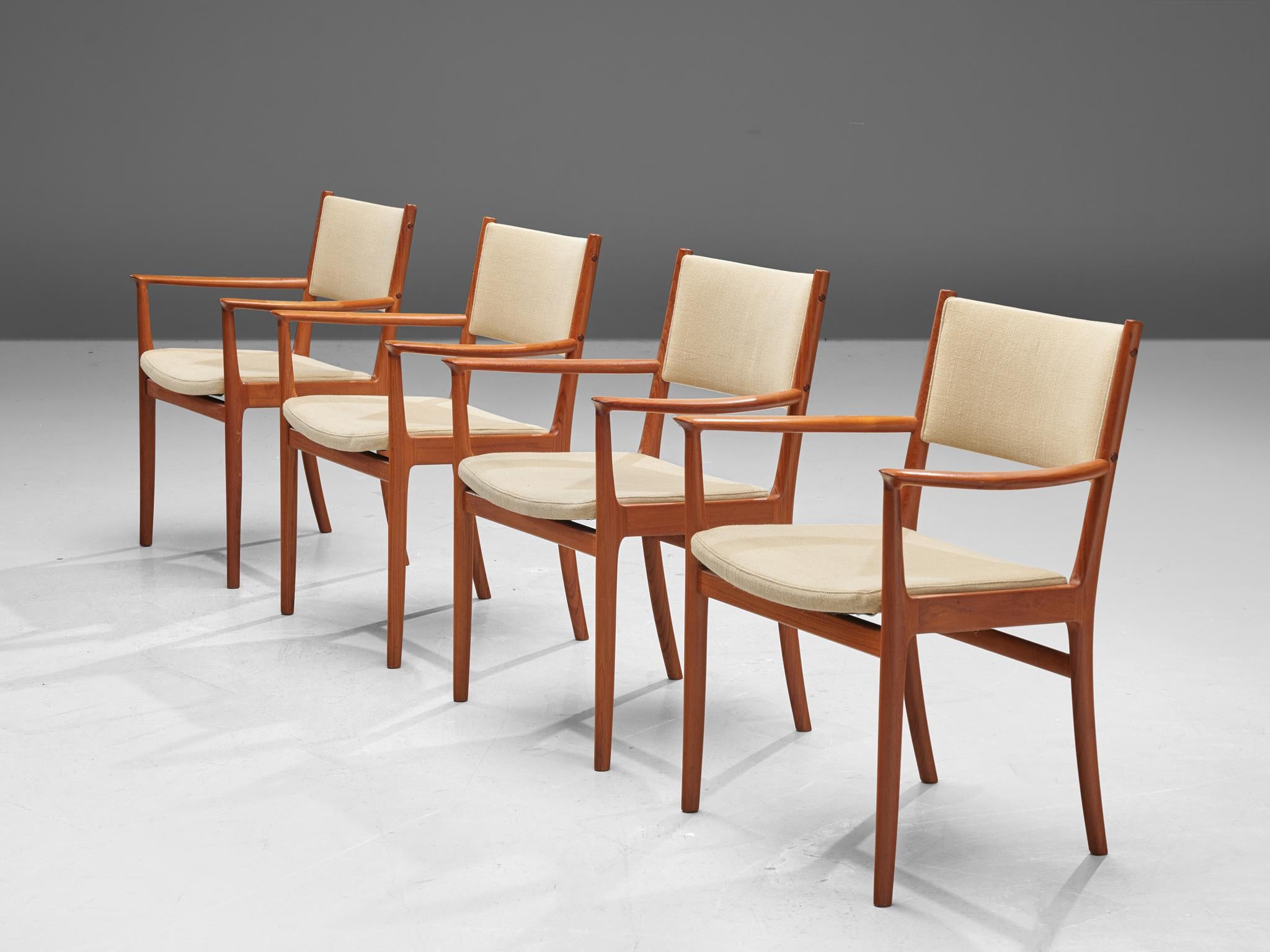 Kai Lyngfeldt Larsen, set of four dining chairs, teak and beige fabric, Scandinavia, 1950s. 

These elegant teak dining chairs are both stately and modest. These Scandinavian chairs have a teak frame with a beautiful visible grain. Nicely curved