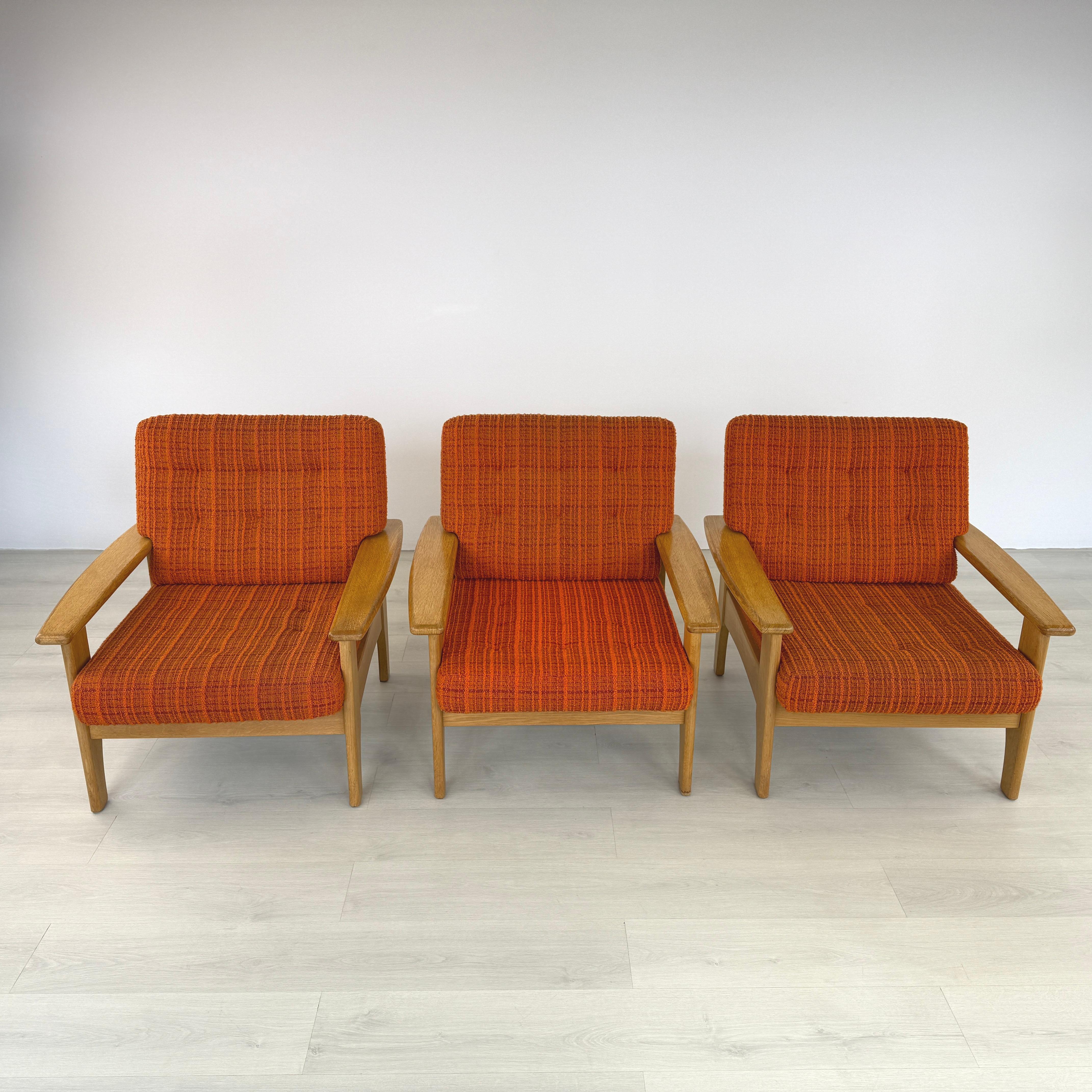 Dimensions: H 32” x W 31.5” x D 32” x SH 16

Set of 3 Mid-Century Modern Scandinavian teak easy chairs with original orange/brown boucle upholstery and loose padded cushions. Solid teak frames. 

Please see our other listings for ideas and matching