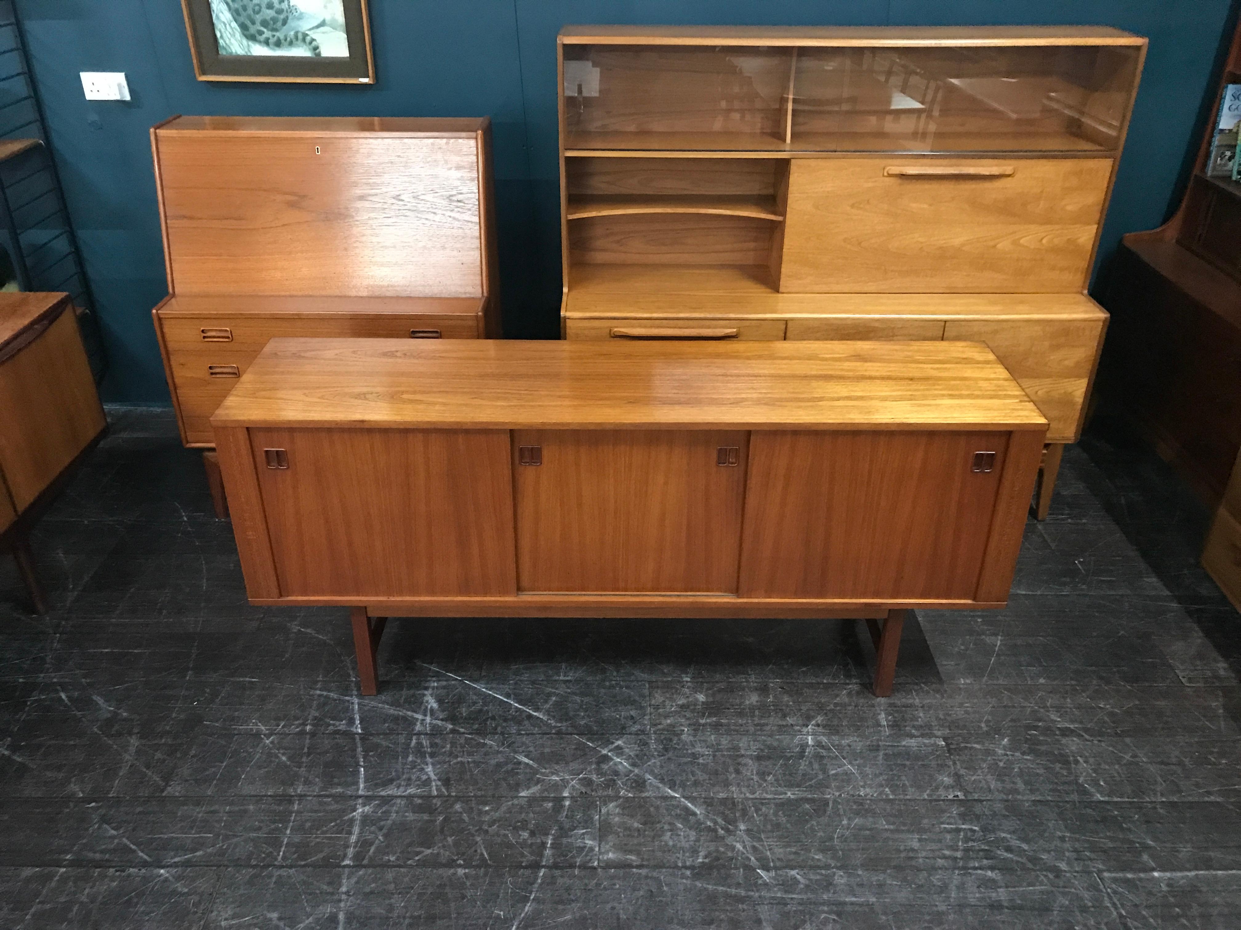 This is a sleek and elegant midcentury Scandinavian sideboard. Very possibly an early Ikea Swedish sideboard. This piece may well be an antique of the future, very similar to the 1960s sideboards that Ikea designed and created, prior to their