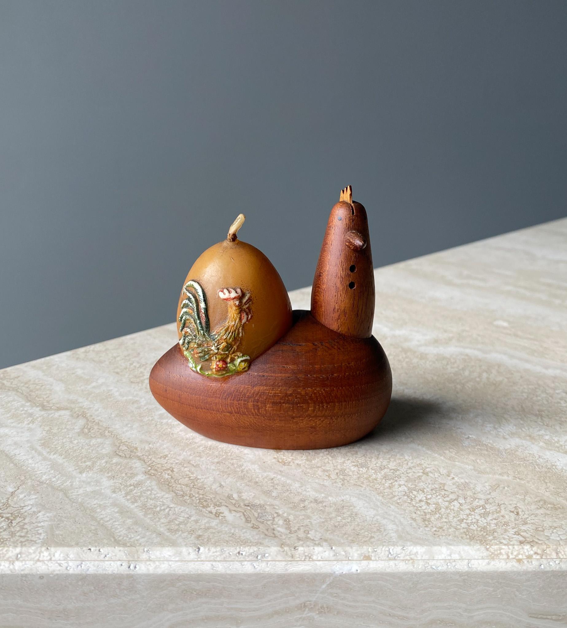 Scandinavian Teak Rooster Egg Holder , comes with an egg shaped candle. Good vintage condition.