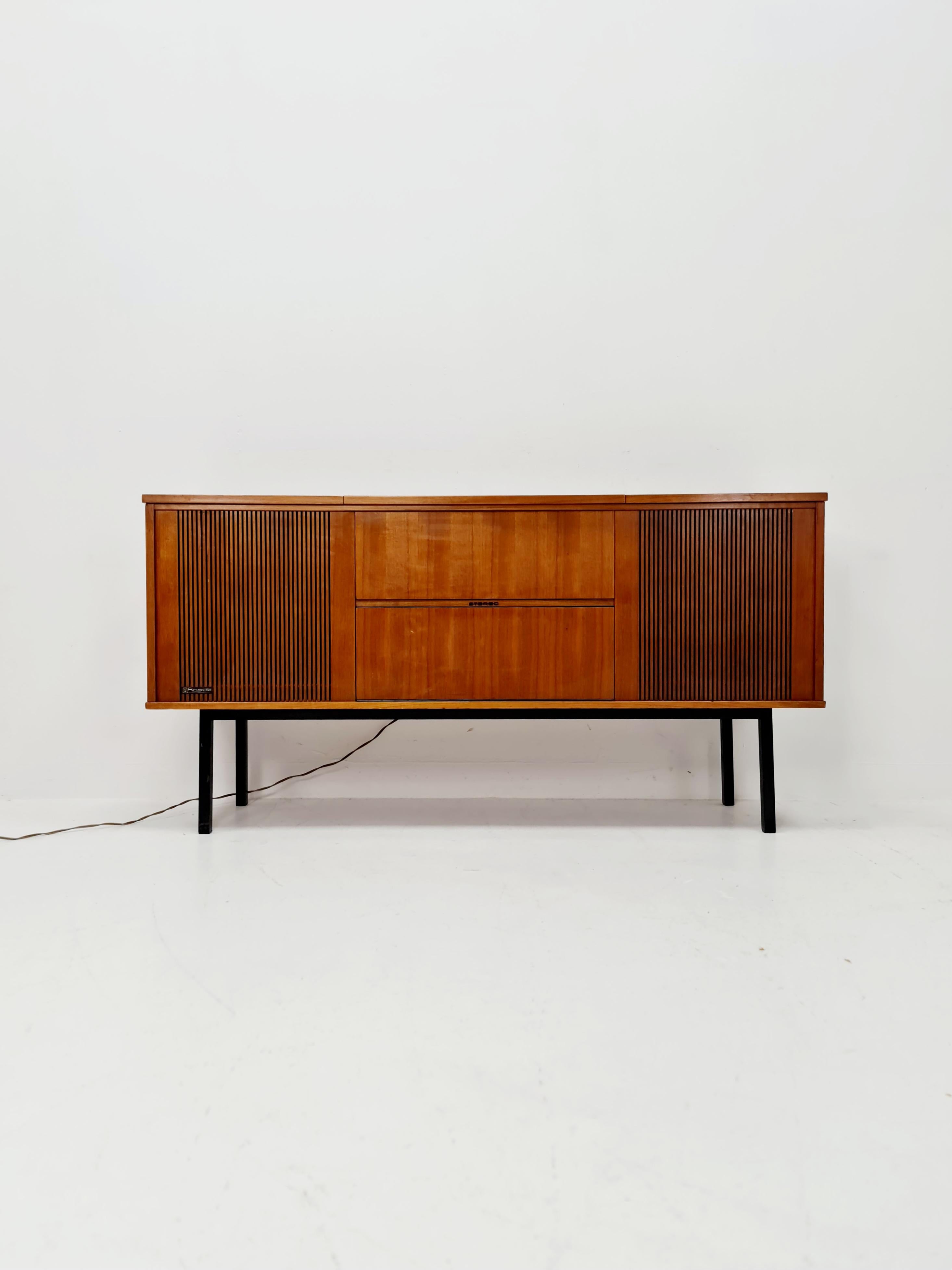 Mid Century Modern scandinavian teak sidboard record player Dual 1210 , radio by Senderwahl 

The radio is in fully functional. as well the vinyl record 
with big space of storage 

Dimensions: 
40 D x 150 W x 75 H

It is in good vintage condition,
