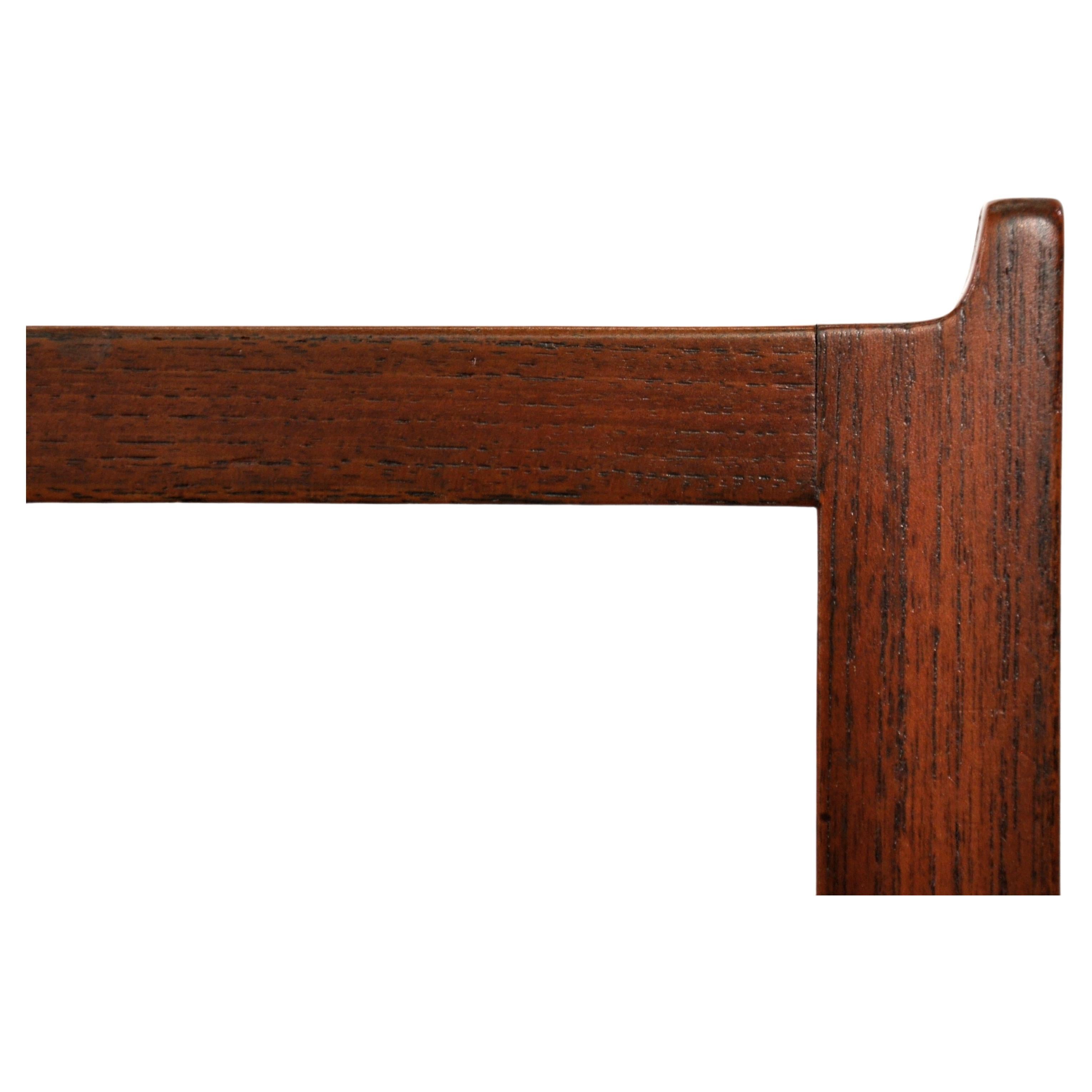 Minimalist teak square end table or small bench with flared side edges, bookmatched wood grain and solid teak legs and spanners. Designed in the 1960s by Brode Blindheim and manufactured in Sykkylven, Norway, the vintage occasional table's classic