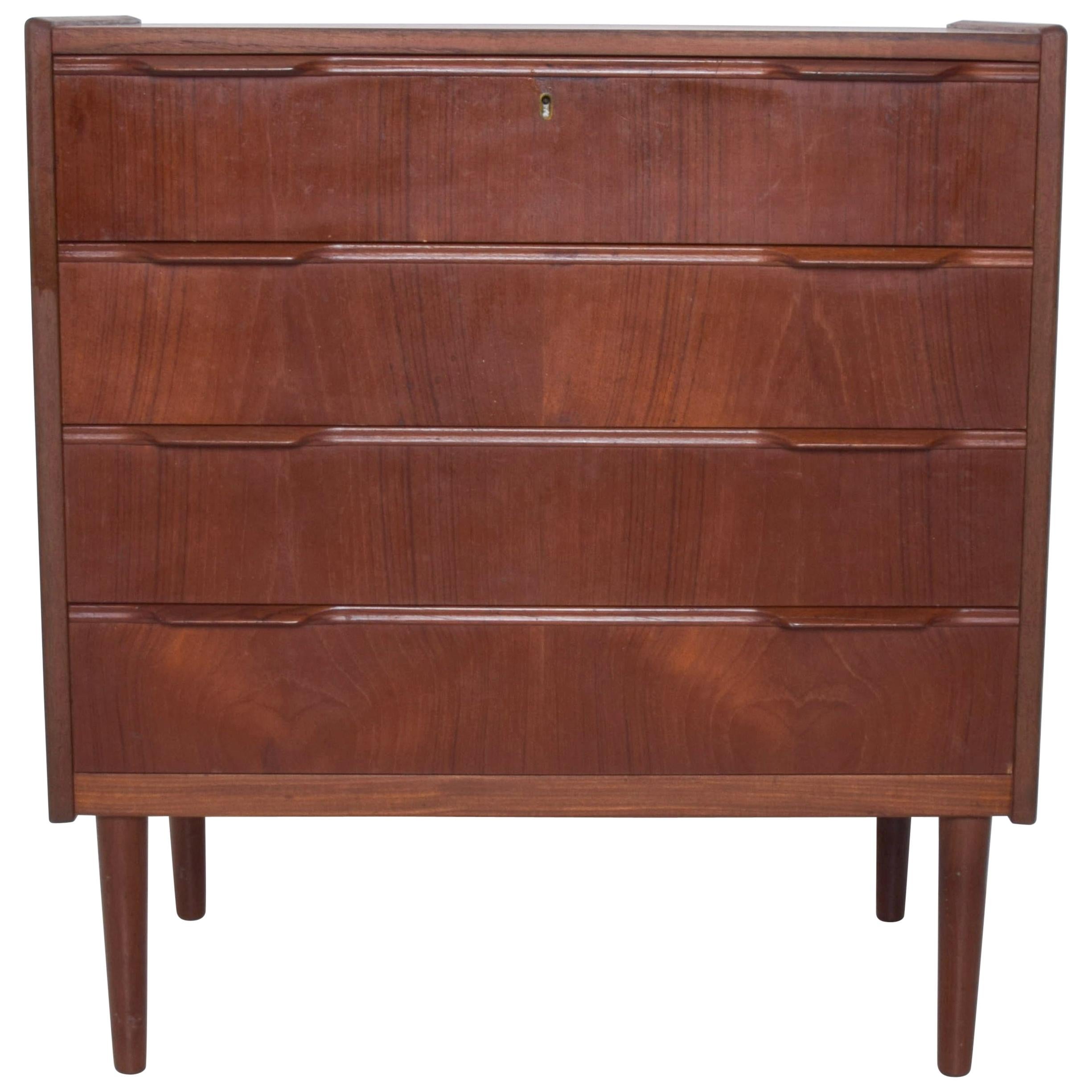 1960s Scandinavian Modern Teak Dresser with Tall Legs Sculptural Carved Handles