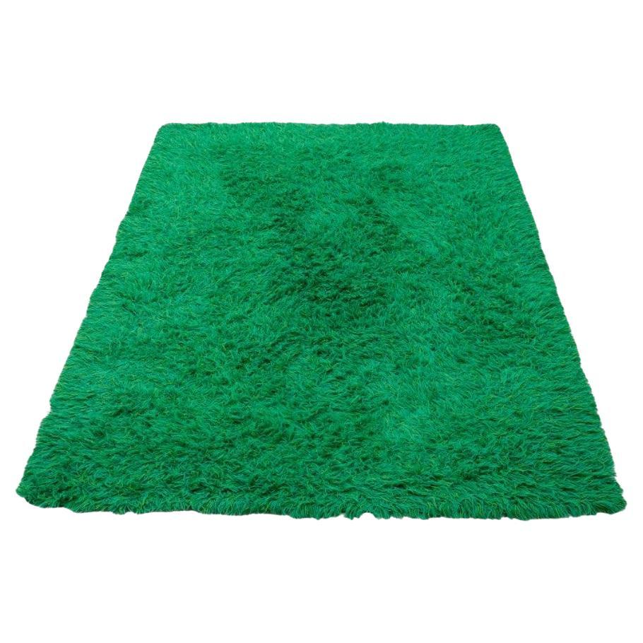 Scandinavian textile designer. Rya carpet in pure cotton. Green tones. 1970s.