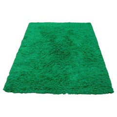 Designer textile scandinave. Tapis Rya en pur coton. Tonalités vertes. 1970.