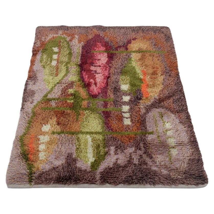 Scandinavian textile designer. Rya carpet in pure cotton. Polychrome design.