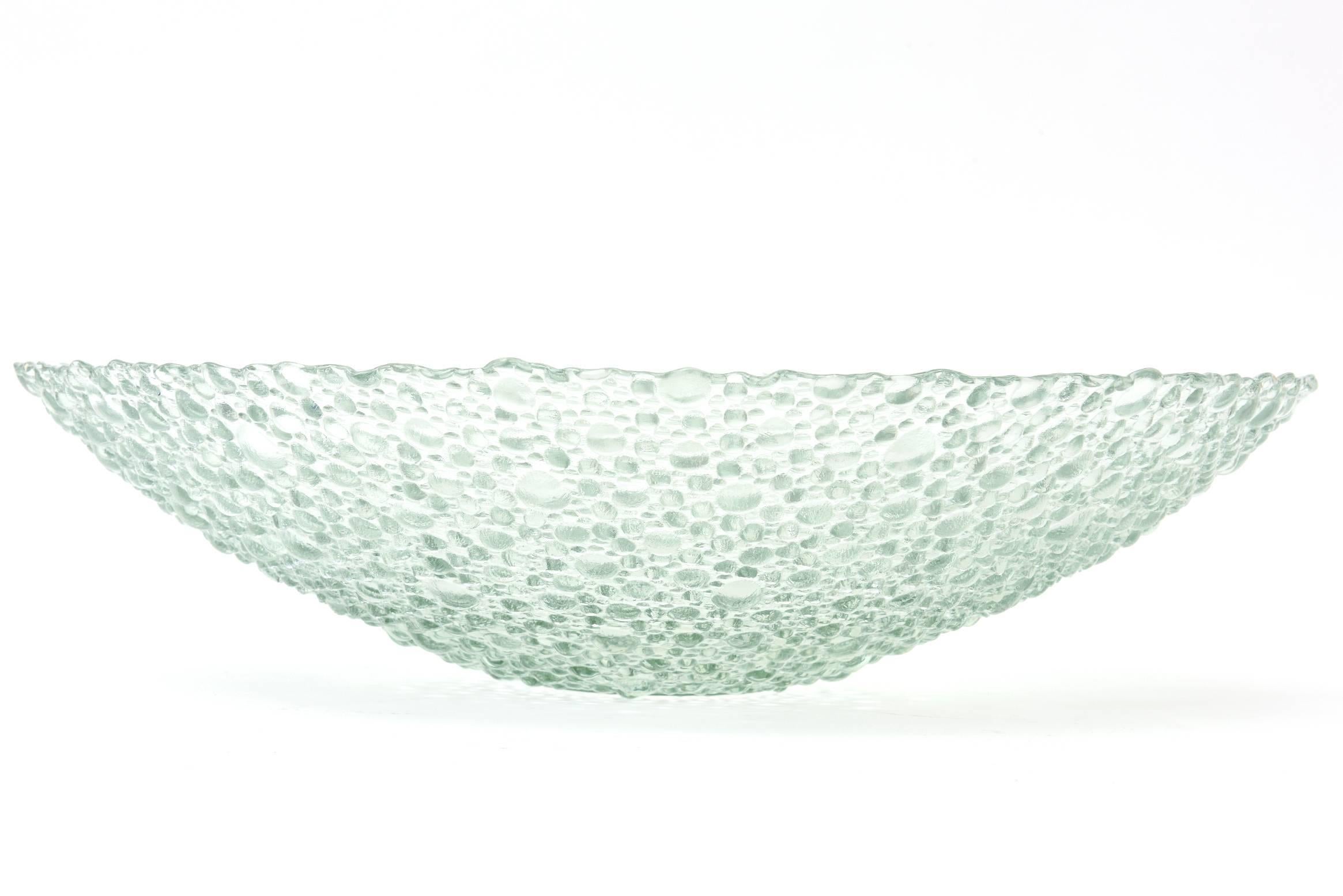 This large and lovely Scandinavian vintage glass bubble clear bowl is textural on the outside. It has great scale and adds a sculptural dimensional with the raised bubbles. It is evocative of the style of Iittala Thule that was originally designed