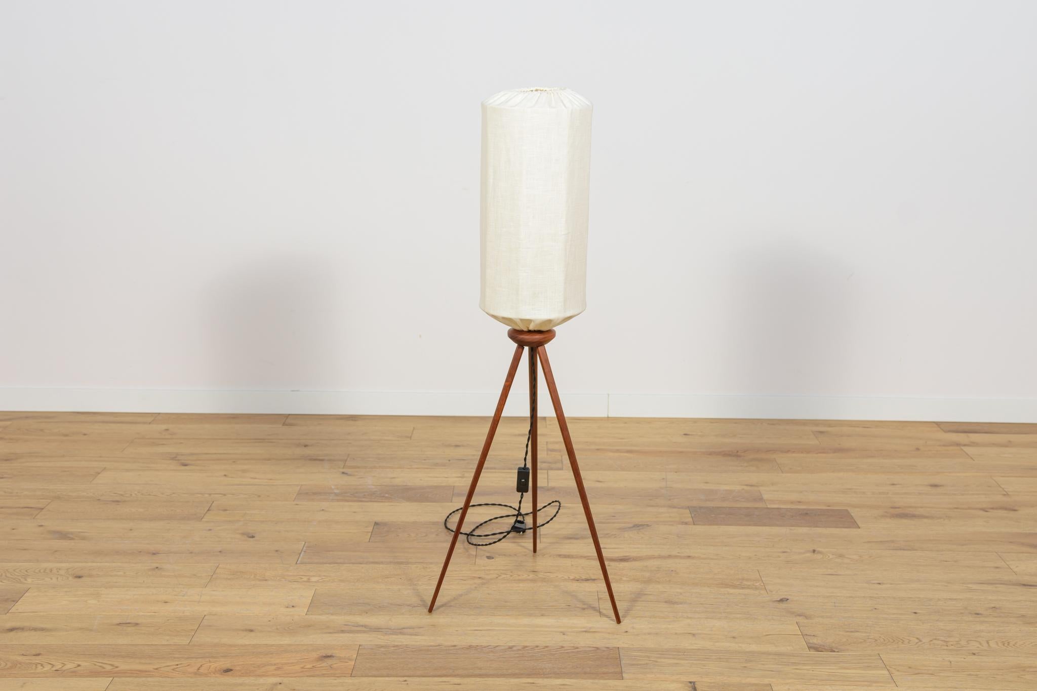 Floor lamp produced in the 1970s in Sweden. The lamp is placed on three legs, giving it a light form. It has undergone a thorough carpentry renovation, was cleaned of the old surface and finished with high-quality Danish oil. The  Lampshade has been
