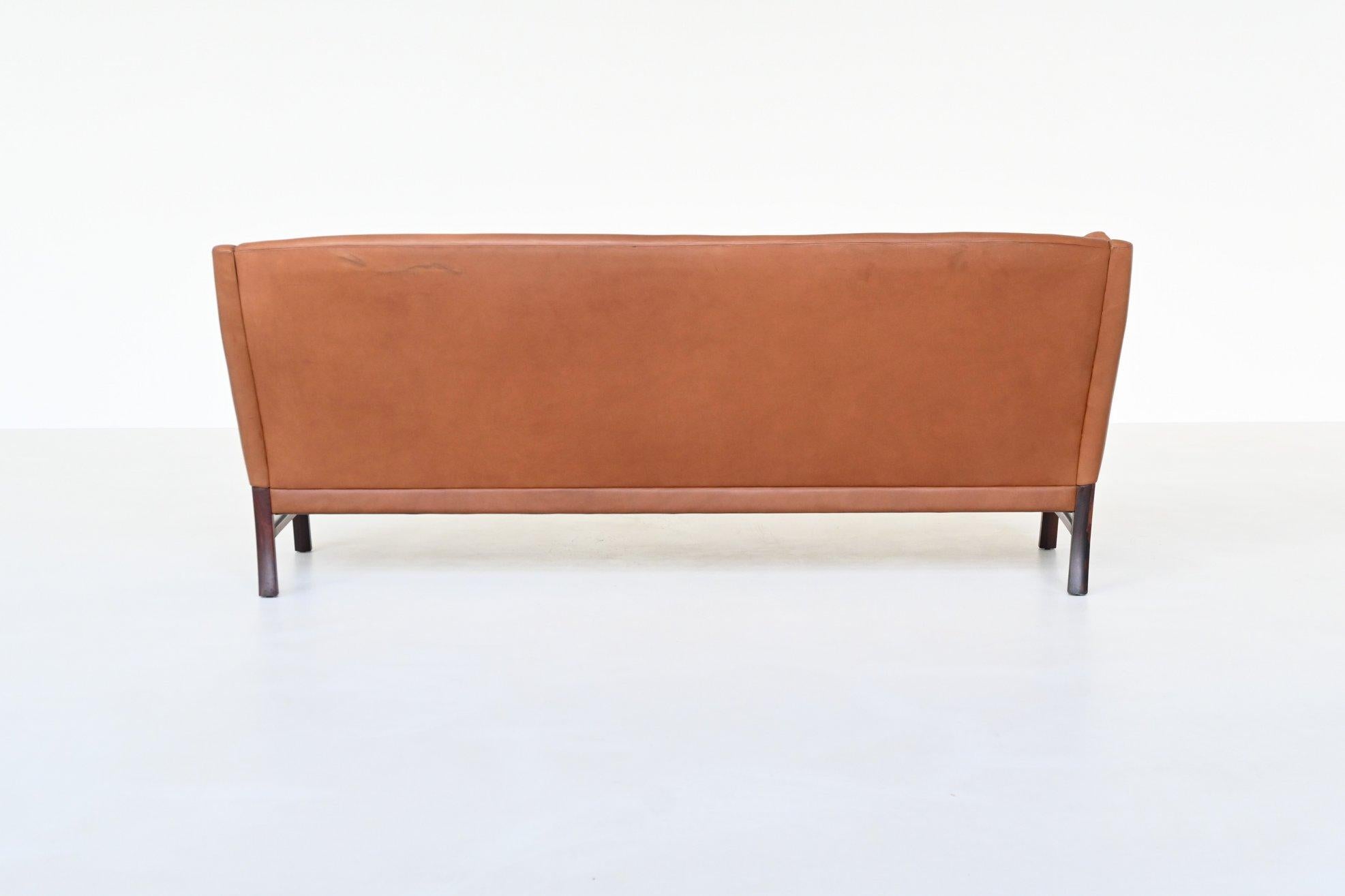 Danese Divano scandinavo a tre posti in palissandro e pelle marrone Danimarca 1960 in vendita