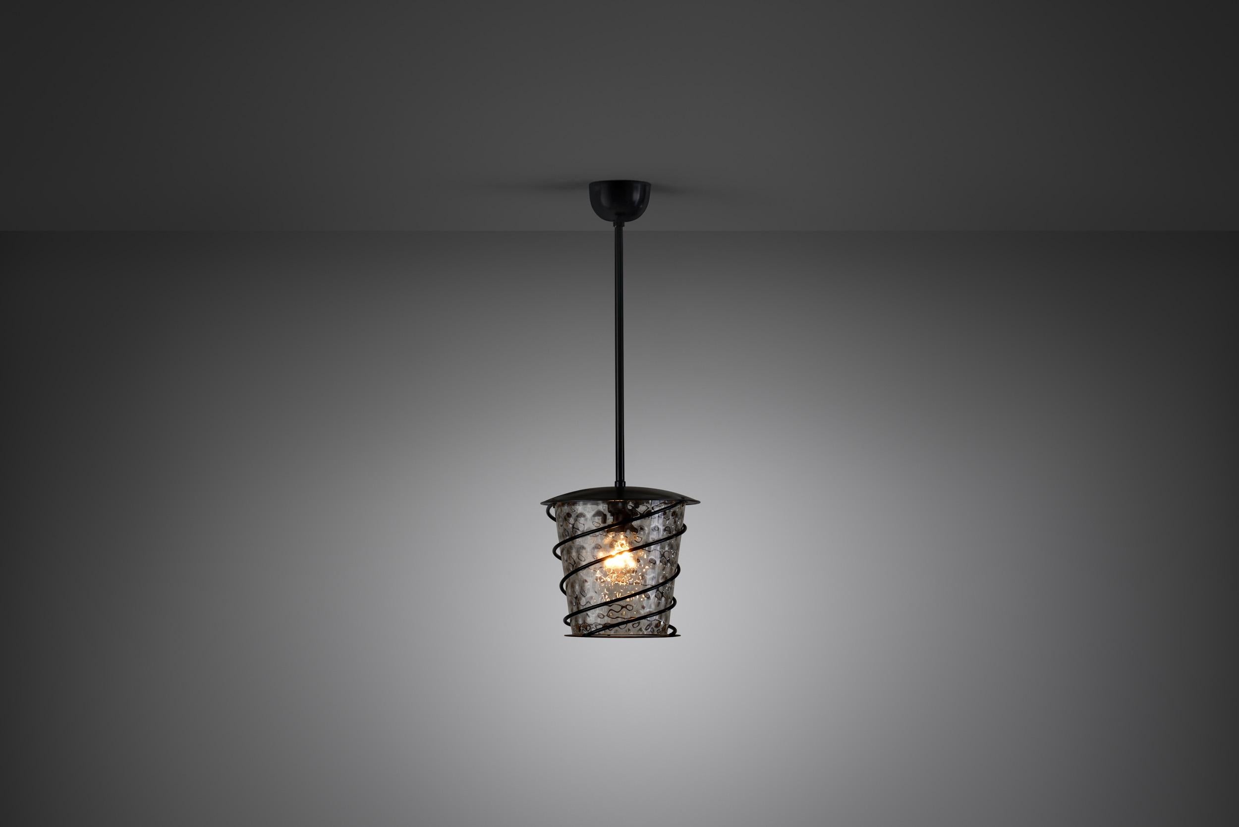 Lighting is a huge part of Scandinavian design, ranging from the warm, low light of a candle to the bright overhead glow of a ceiling light. This early 20th century ceiling lamp is a unique piece of functionalist design with the unmistakeable