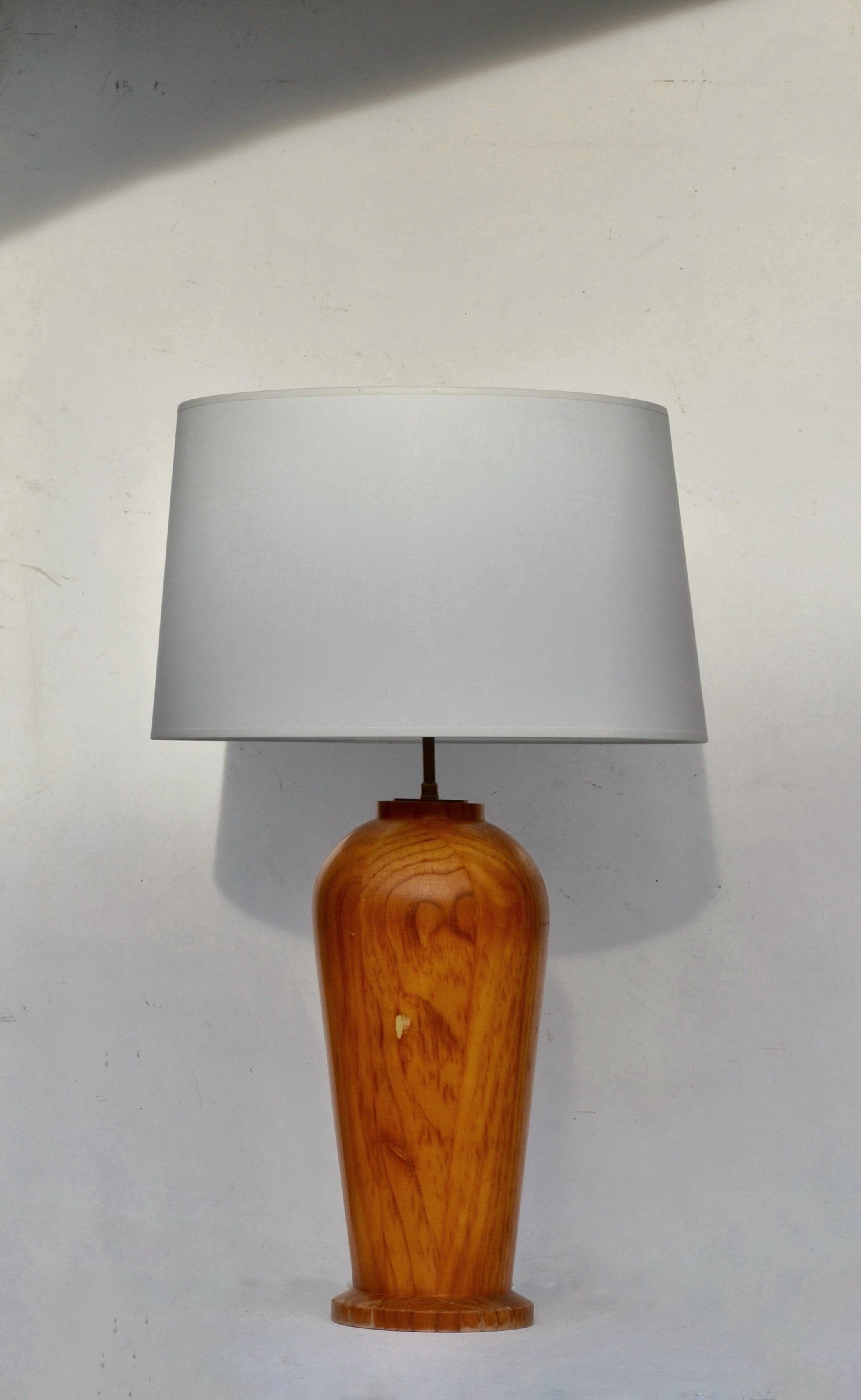 Elegant Scandinavian table lamp from the 1970s, crafted from turned pine wood with brass details.
This piece embodies the refined simplicity and natural warmth characteristic of Nordic design from this era.

The lamp has been fully restored and