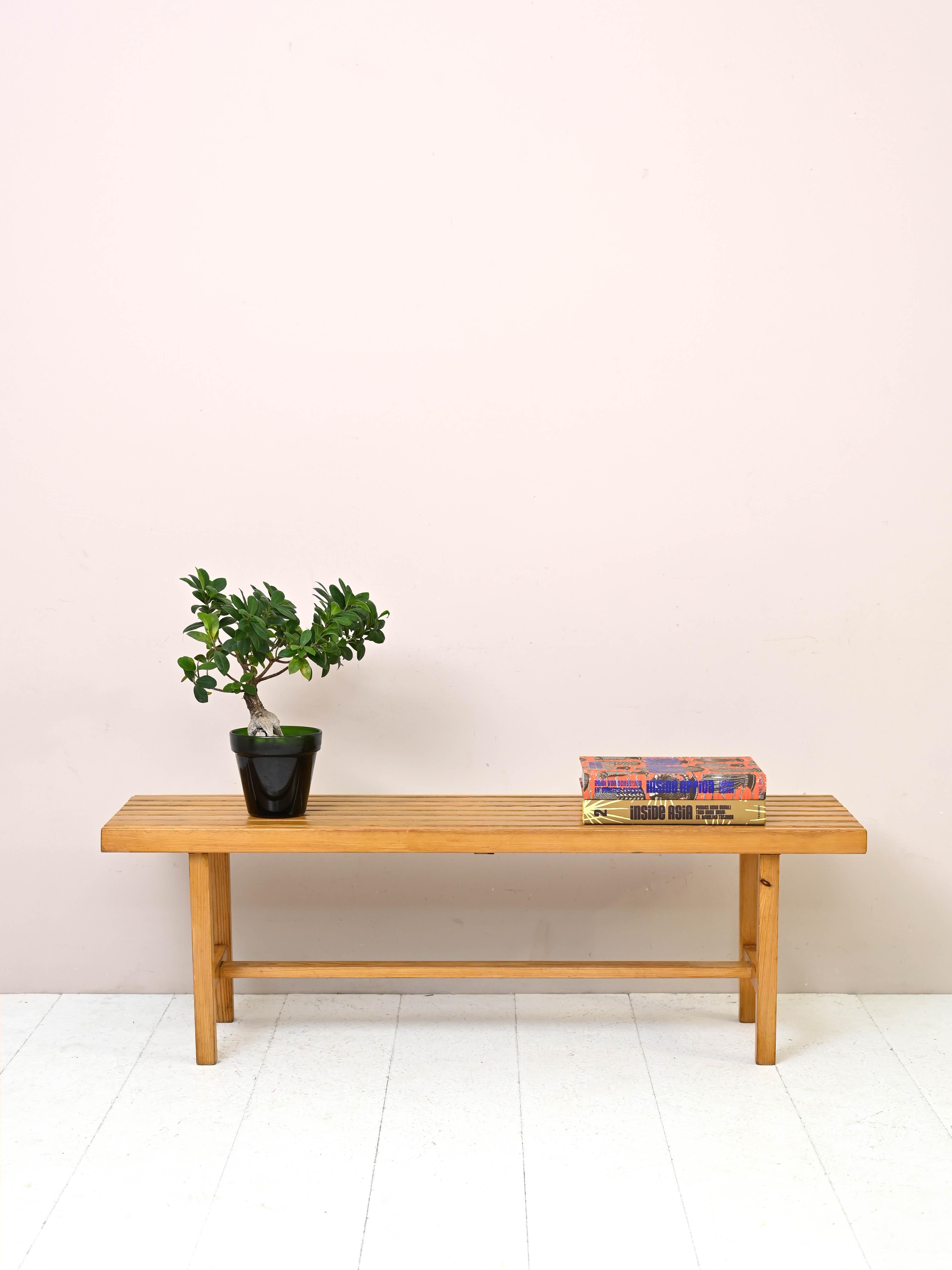 Vintage pine wood bench.

A simple, square-shaped piece of furniture that can be used for multiple functions and in different rooms of the house, such as a bed base, at the entrance, in the living room and even as a TV stand.
The minimal and