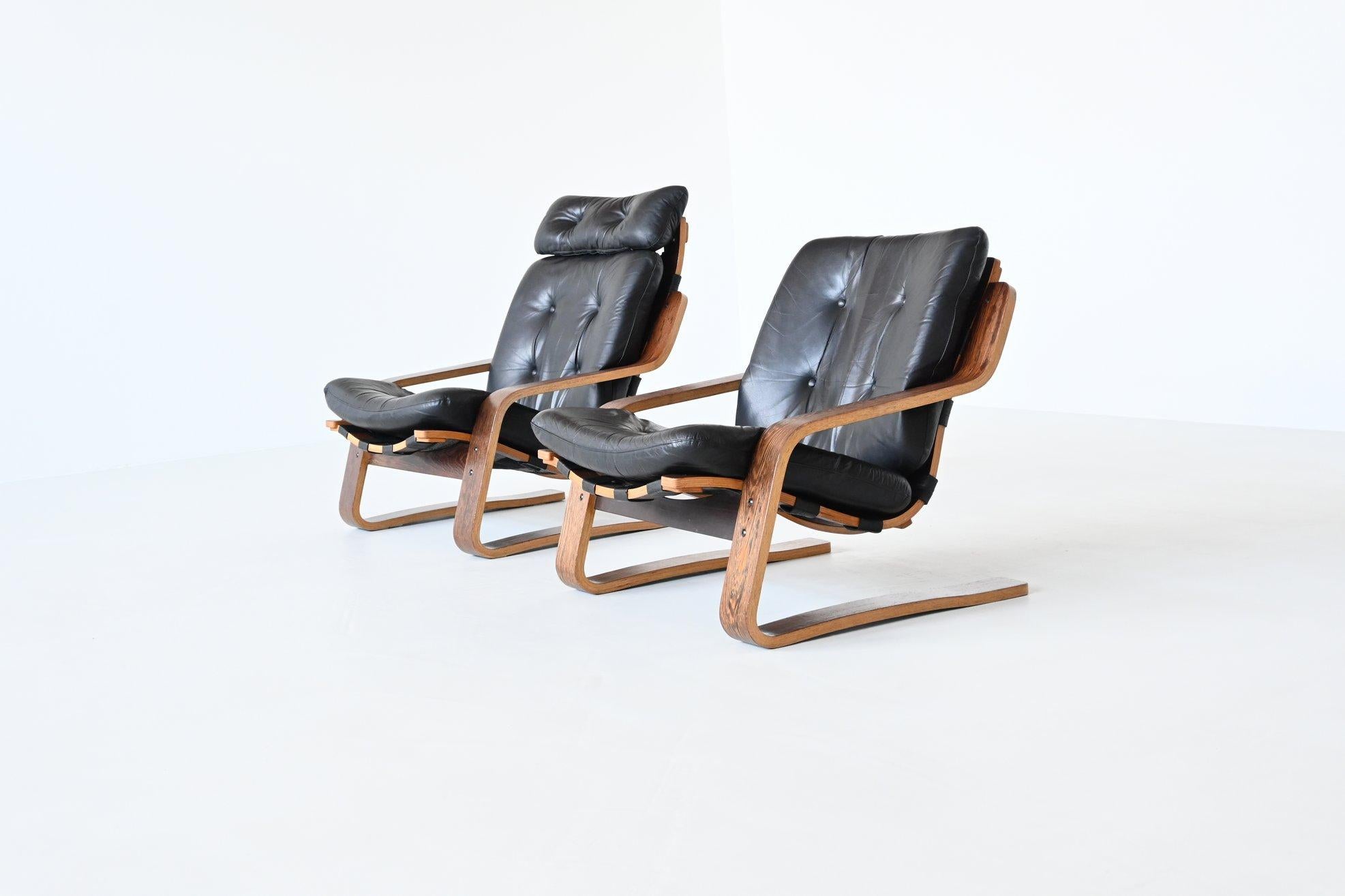 Superb shaped pair of plywood Scandinavian lounge chairs in the style of Ingmar Relling, Norway 1970. This beautiful but unknown design is a combination of designs by Ingmar Relling from Norway because of the wood, leather and canvas and Alvar Aalto