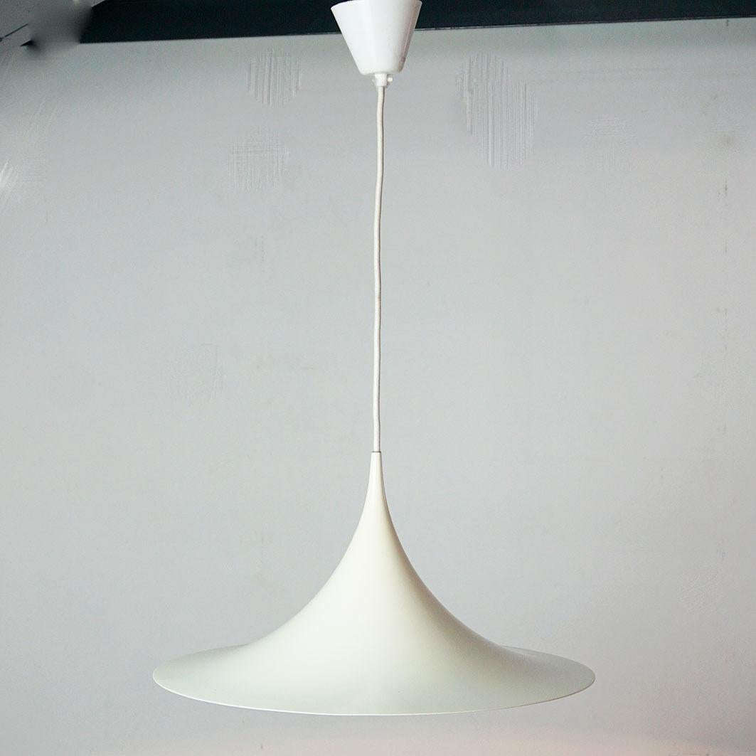 This white semi pendant lamp is one of the most iconic designs produced by Fog & Mørup and designed by Torsten Thorup and Claus Bonderup in Denmark, 1968. It is in very good condition and has a 47 cm diameter, making it perfect over a dining or