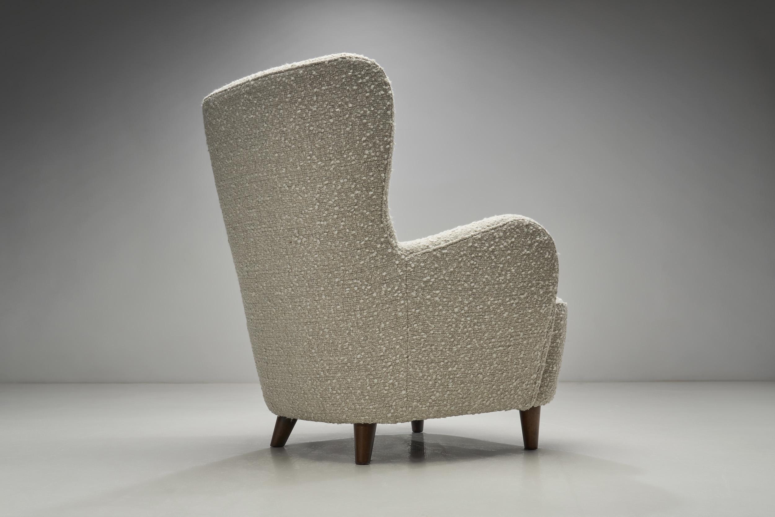 Mid-Century Modern Scandinavian Wingback Armchair Upholstered in Bouclé, Scandinavia, 1950s For Sale