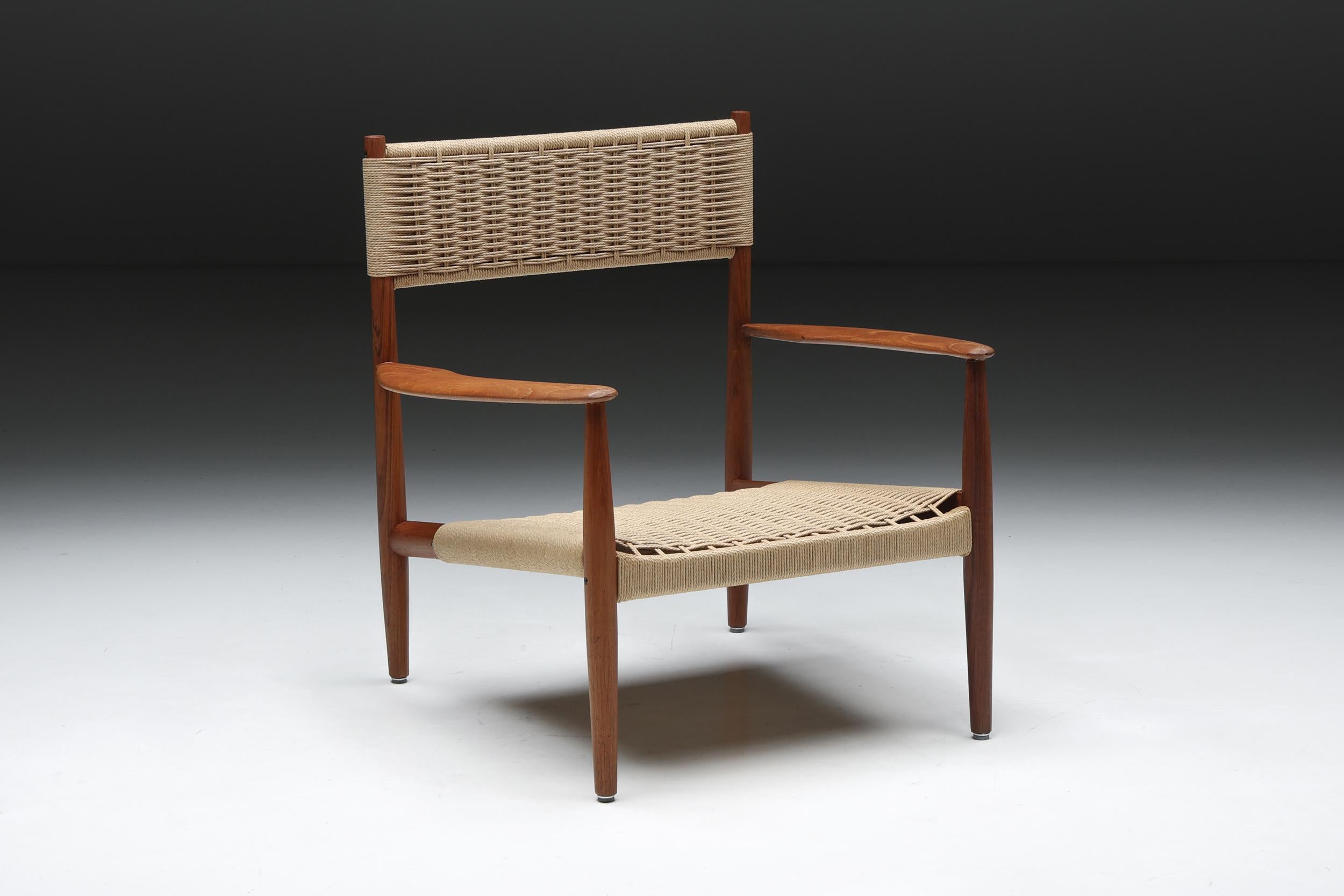 Danish; Scandinavia; Scandinavian Design; Denmark; Wooden Armchair; Cord Webbing; 1960s; 

Scandinavian armchair featuring a wooden frame with the backrest and seat in cord webbing. This Danish design combines functionality with an aesthetically