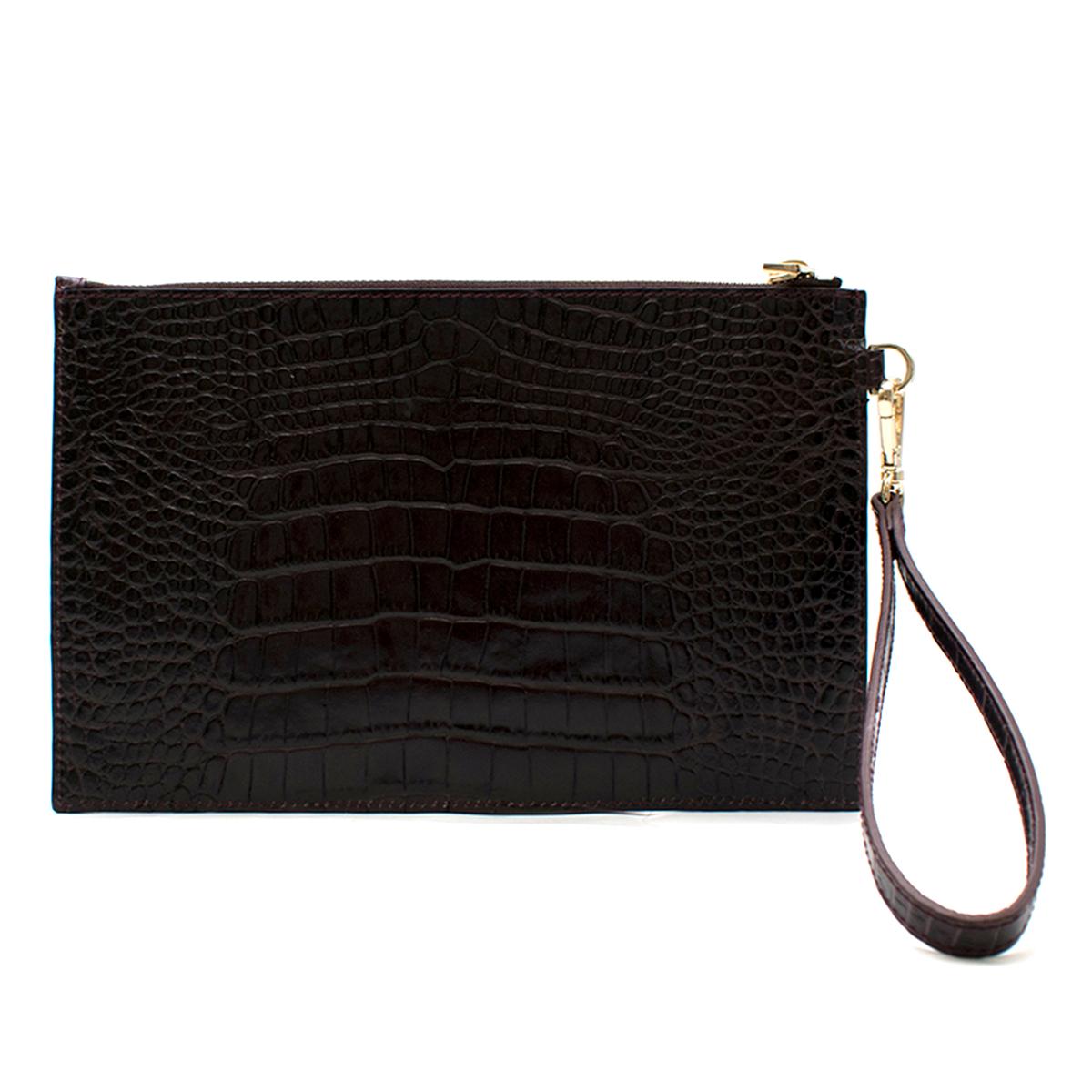 Scanlan Theodore Purple Envelope

- Dark Purple Envelope Bag 
- Croc-effect leather 
- Gold toned zip closure 
- De-tachable bracelet handle with gold toned metal 

Please note, these items are pre-owned and may show some signs of storage, even when